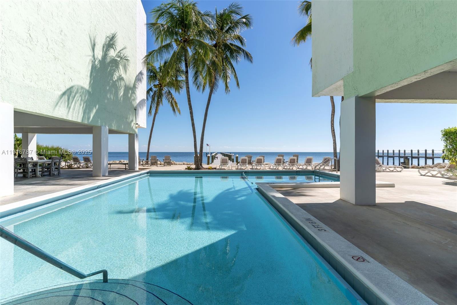 WELCOME TO PARADISE BY THE SEA! THIS SPACIOUS CONDO LOCATED ON MILLIONAIRE'S ROW IN AN OCEANFRONT BUILDING OFFERS THE PERFECT BLEND OF COMFORT & CONVENIENCE, THIS BEAUTY FEATURES AN OPEN CONCEPT LIVING AREA, WELL APPOINTED KITCHEN WITH WOOD CABINETS, & A 1/2 BATH DOWNSTAIRS.  WALK UPSTAIRS TO A COZY SPLIT BEDROOM FLOOR PLAN FOR PRIVACY. PRIMARY SUITE INCLUDES A WALK-IN CLOSET. OUTSIDE OFFERS COVERED PARKING, PLENTY OF GUEST PARKING, STORAGE UNIT, NEW ROOFS ON BOTH BUILDINGS, LOW MONTHLY MAINTENANCE FEE INCLUDES WATER, HEATED POOL, COMMUNITY ROOM WITH KITCHEN, DOCK/FISHING PIER, , GYM, & SAUNA. WHETHER YOU’RE LOOKING FOR YOUR NEW HOME, A WEEKEND VACATION GETAWAY, OR INVESTMENT PROPERTY, THIS CONDO IS MOVE-IN READY & PERFECTLY LOCATED WITHIN WALKING DISTANCE TO RESTAURANTS AND SHOPPING!