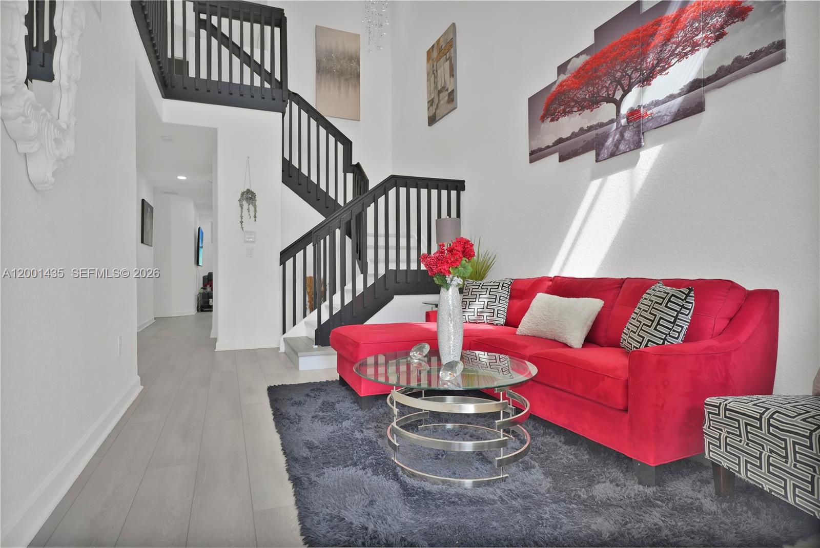 Beautifully upgraded and exceptionally spacious townhouse offering 1,704 sq ft—larger than most in the area! This move-in-ready home features soaring vaulted ceilings and an open, light-filled layout that creates a welcoming and airy atmosphere from the moment you walk in.

Freshly painted throughout, the interior is complemented by all-new wooden flooring, adding warmth and a modern, cohesive look. The living area is enhanced with new recessed lighting, while large sliding glass doors bring in natural light and provide access to a private outdoor space—perfect for relaxing or entertaining.

Enjoy additional outdoor living with a private balcony, ideal for morning coffee or unwinding in the evenings.

The home also includes a brand-new washer and dryer for added convenience. All bathrooms have been thoughtfully updated with new faucets and new toilets, offering a clean, refreshed feel throughout.

The exterior showcases charming curb appeal with a private garage and a welcoming entry, all set within a well-maintained community.

A major advantage: no HOA approval required for move-in, allowing for a fast and seamless process—ideal for both homeowners and investors.

Spacious, stylish, and truly turnkey—this is one of the best values in the area. Schedule your showing today!