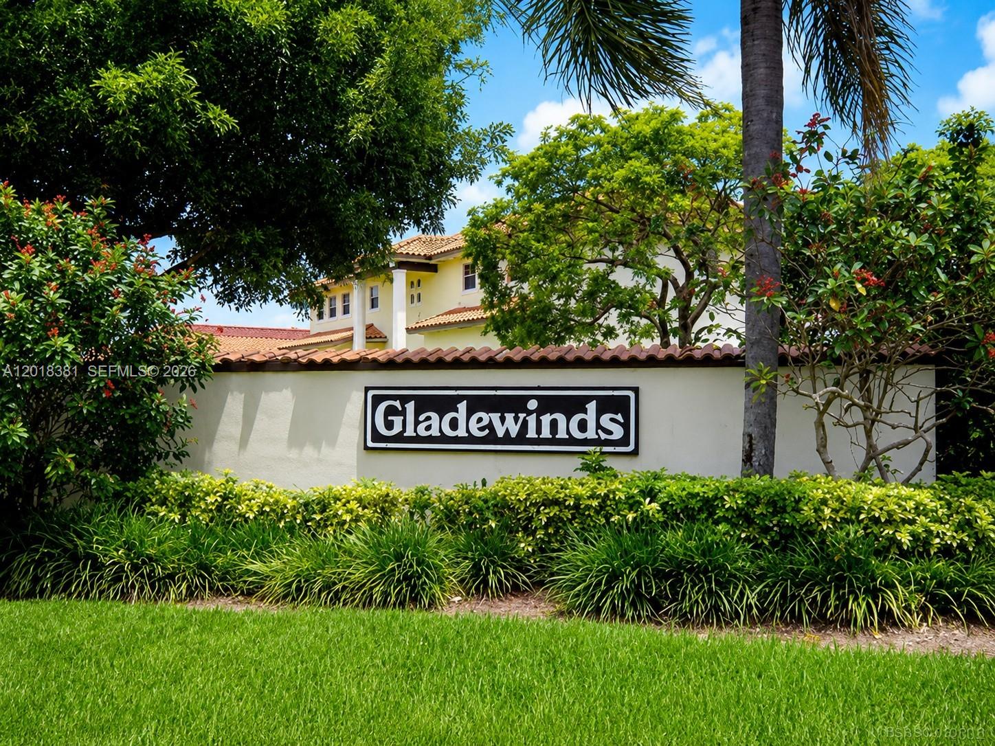 Welcome to Gladewind Heights, a gated community in the heart of Kendall! This spacious 2-story home features 3 bedrooms and 3 full bathrooms, including one bedroom and full bath on the first floor. Tax roll reflects a 4/3 with open den configuration. Bright living areas offer vaulted ceilings, ceramic and wood floors, formal living/dining spaces, and Florida room. Upgraded kitchen with granite countertops, stainless steel appliances, breakfast nook, and ample cabinetry. Spacious primary suite with walk-in closet, double sinks, soaking tub, and en-suite bath. Roof, electrical panel, and A/C condenser are 5 years old; fence is 3 years old. Features include paved patio/terrace, covered carport with storage, accordion shutters, laundry room, and extra-parking. Low HOA of $170/month with pool, clubhouse, gym, and playground. Centrally located near schools, shopping, dining, parks, and major expressways. Showings will beging end of June 2026.