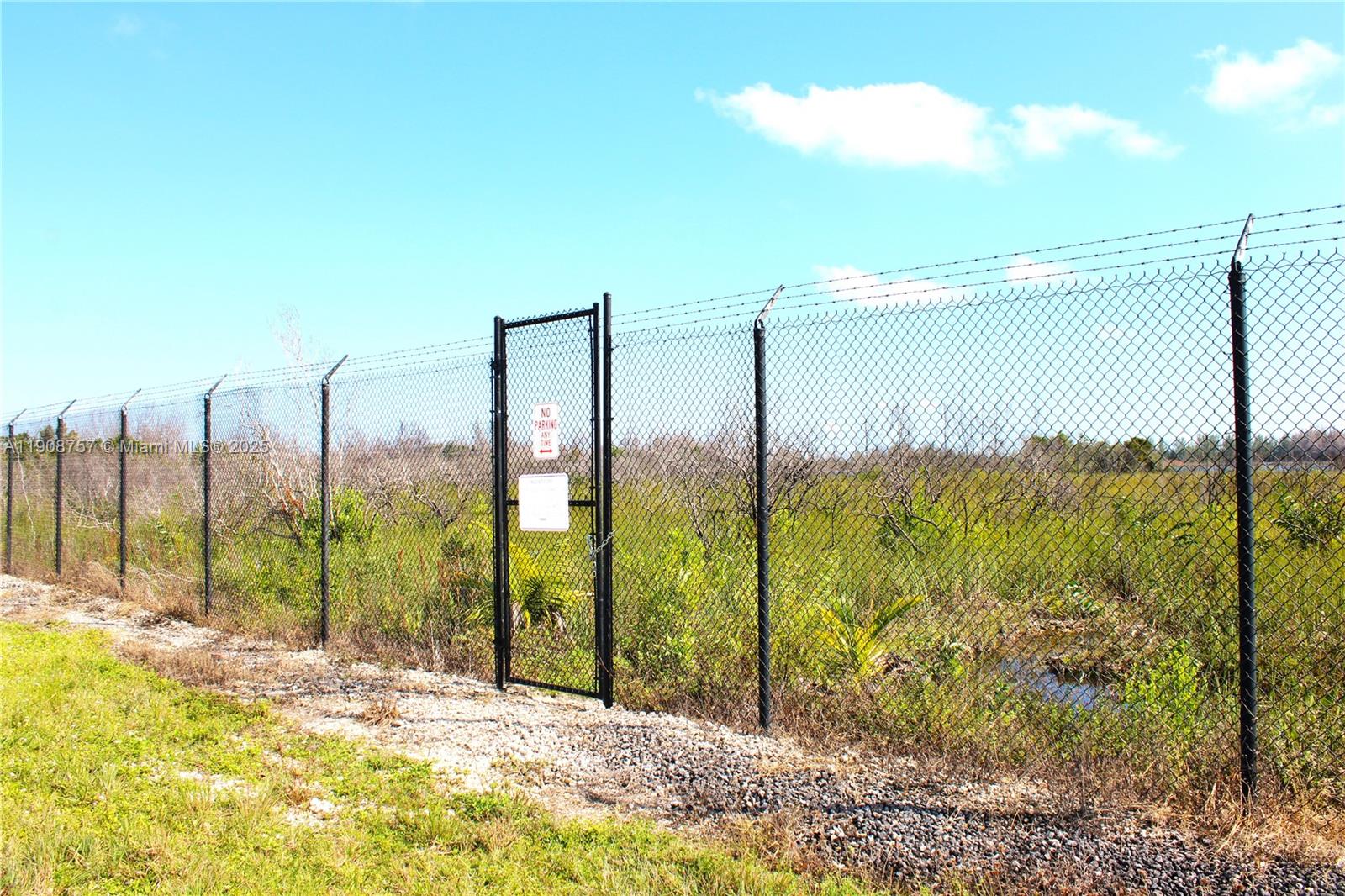 Welcome to your own private oasis on the way from Miami to the Florida Keys! This 30,056.4 Sq.Ft vacant lot comes with a canal at the back, providing stunning water views and endless opportunities for possible future outdoor opportunities. The property is securely gated, offering peace of mind and privacy for you and for your investment. The busy road that crosses in front of the property provides convenient access to nearby amenities and attractions, making this an ideal location for those who enjoy the hustle and bustle of city life. Don't miss out on this rare opportunity to own a piece of paradise in one of the most sought-after locations in South Florida. Come see it for yourself and make this dream investment a reality today!