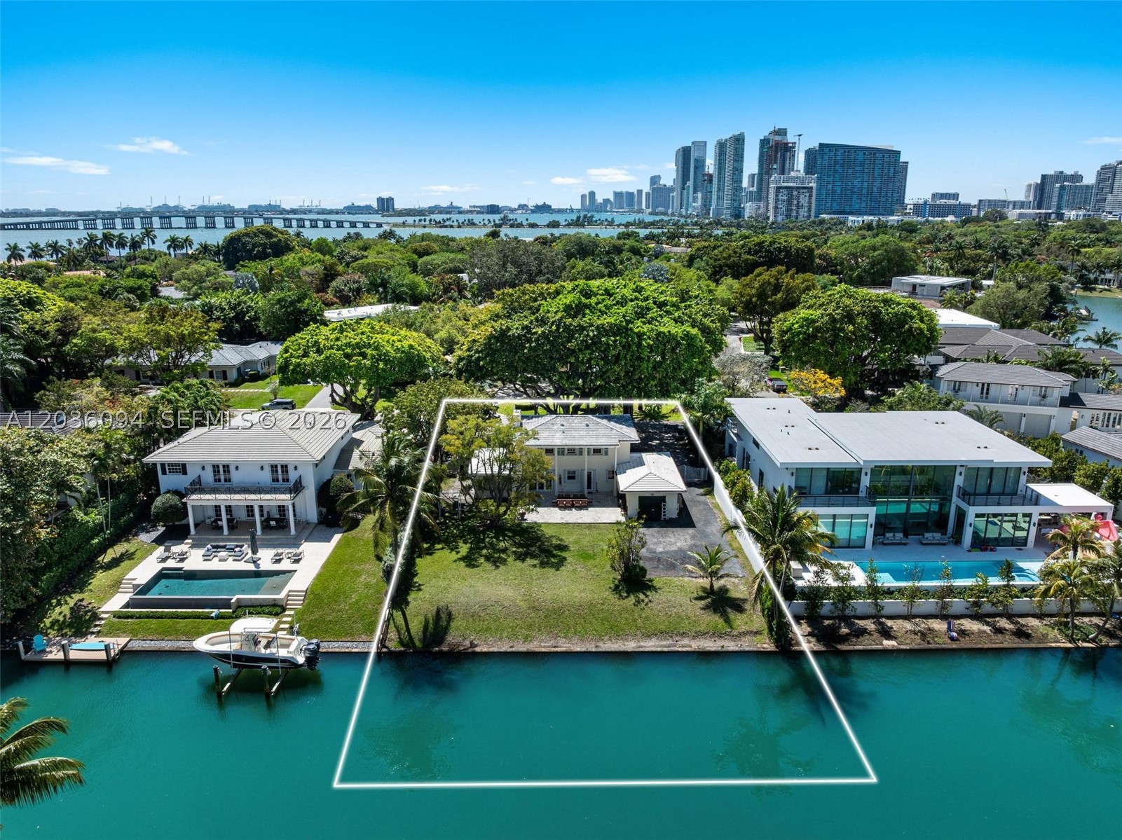 Welcome to 655 Buttonwood Lane, a rare waterfront opportunity on the north side of Bay Point’s only private island. Situated on a sprawling 13,590 SF lot, this charming residence is framed by one of Miami’s most magnificent banyan trees, creating an unforgettable arrival experience. Overlooking the island’s only park, the property enjoys a tranquil, private setting with 90 feet of water frontage. Filled with character and timeless appeal, the home offers approximately 3,000 SF of living space.