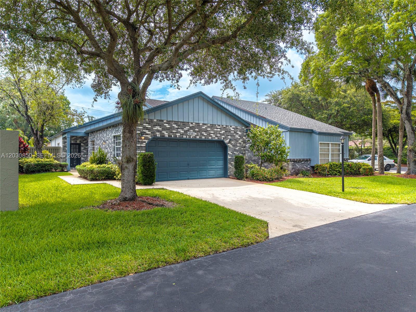 Discover a rare opportunity in The Mews of Cypresshead, one of Parkland's most charming neighborhoods. 6561 Sutton Court features a bright, spacious living area with soaring volume ceilings. The thoughtful layout includes a large primary suite with two walk-in closets and a dedicated office easily convertible into a third bedroom. Offering a true "blank slate," this home is priced with your vision in mind—ready for the custom updates that will make it uniquely yours. For added peace of mind, the air conditioning system is less than a year old!
Enjoy outdoor living on your private screened patio, plus the everyday convenience of a 2-car garage. The Mews offers a fantastic lifestyle with a remarkably low HOA that includes access to a community pool, basketball court, and tennis courts.

Beyond the community, you are perfectly positioned near Parkland's renowned A+ rated schools, beautiful local parks, upscale shopping, and fine dining. With quick access to the Sawgrass Expressway, commuting and exploring South Florida is a breeze. Don't miss this chance to customize your dream home in this highly sought-after community! Please view the comprehensive 3D/360 virtual tour for a complete walkthrough and more details.
