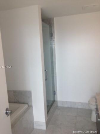 One of few of the buildings in Downtown Miami with a mix of luxury, culture, and pleasure. Unit upgraded with elegant marble floors. Everything is in immaculate condition. Granite counter tops in kitchen with wood cabinets and stainless steel appliances. Amazing city and bay views. Great amenities in bldg., including panoramic views of Biscayne Bay from pool, tropical gardens, bar and lounge, movie game room, private pantry and catering kitchen, game room, and billiards.