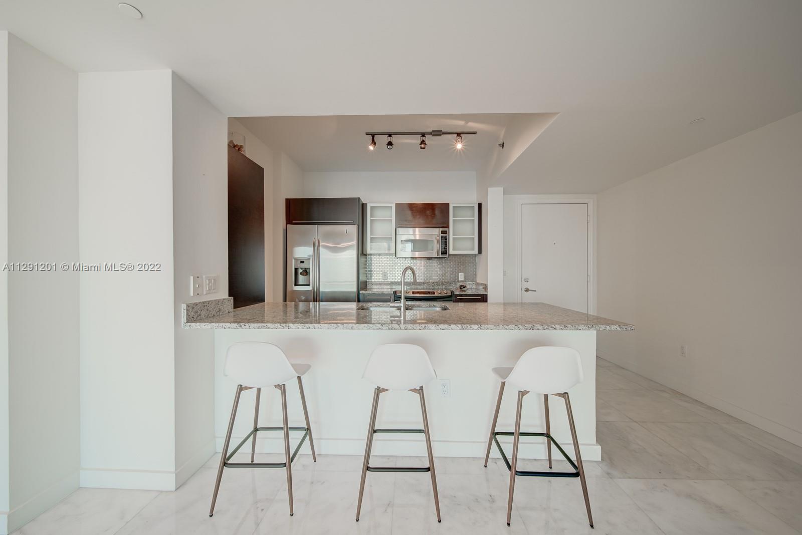 THE PLAZA 901 BRICKELL CO - Residential Lease