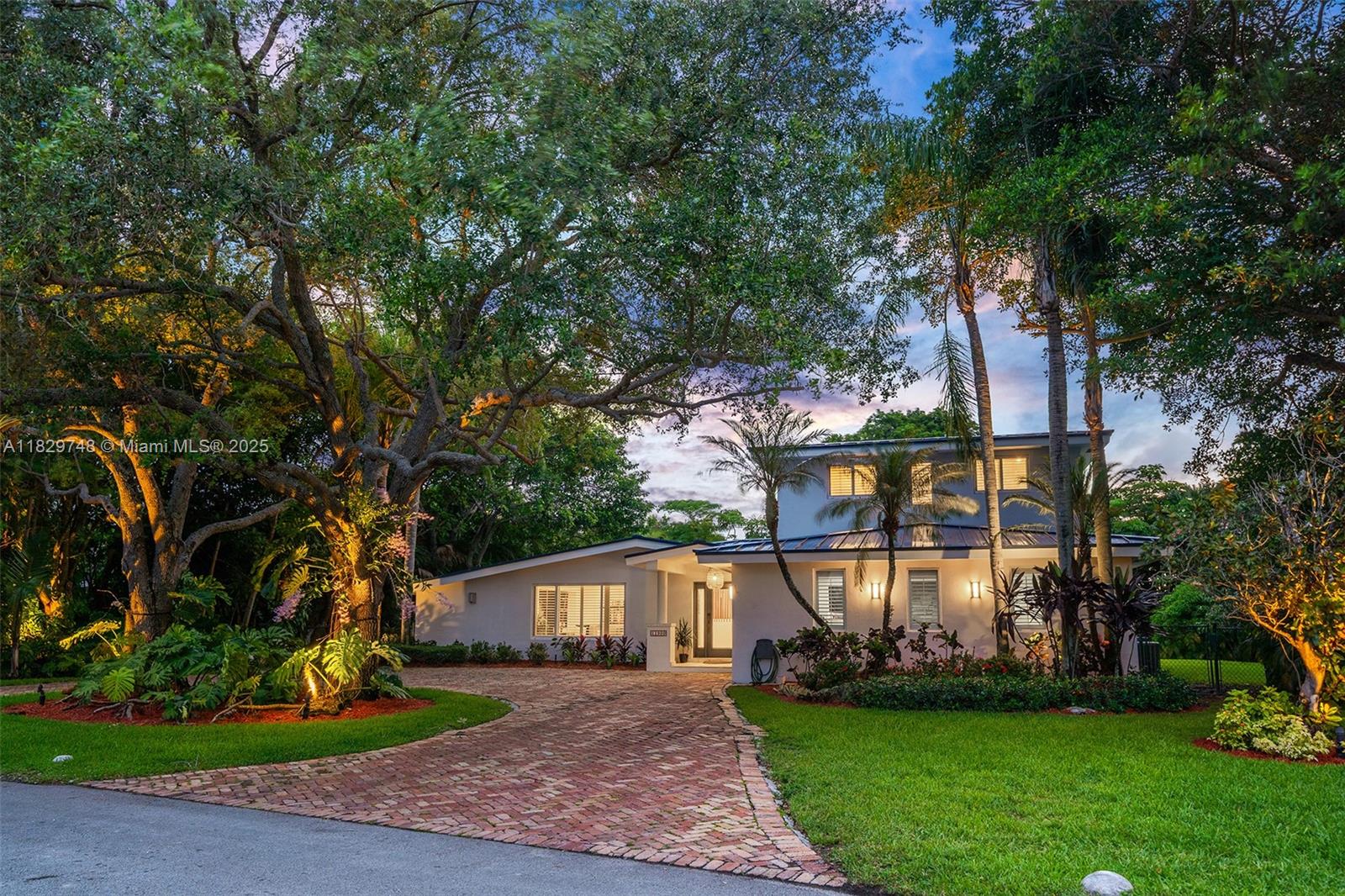 Welcome to this turnkey charming Pinecrest home located on a quiet coveted street. This tropical oasis is set on one of the largest lots in the neighborhood (21,469 sf), boasting a lush backyard complete with an entertainment patio, grill, pool, and mature fruit trees throughout.The home features a fully remodeled main living area with new flooring, a brand-new kitchen, custom dining woodwork, and a bespoke library. Enjoy peace of mind with a 2023 metal roof and full impact windows and doors.  Upstairs, the oversized primary suite includes a large walk-in closet and an additional room ideal for a gym or office. Located near Miami's top public and private schools. Easy to Show. Contact listing agent for a private preview. This home will not last!