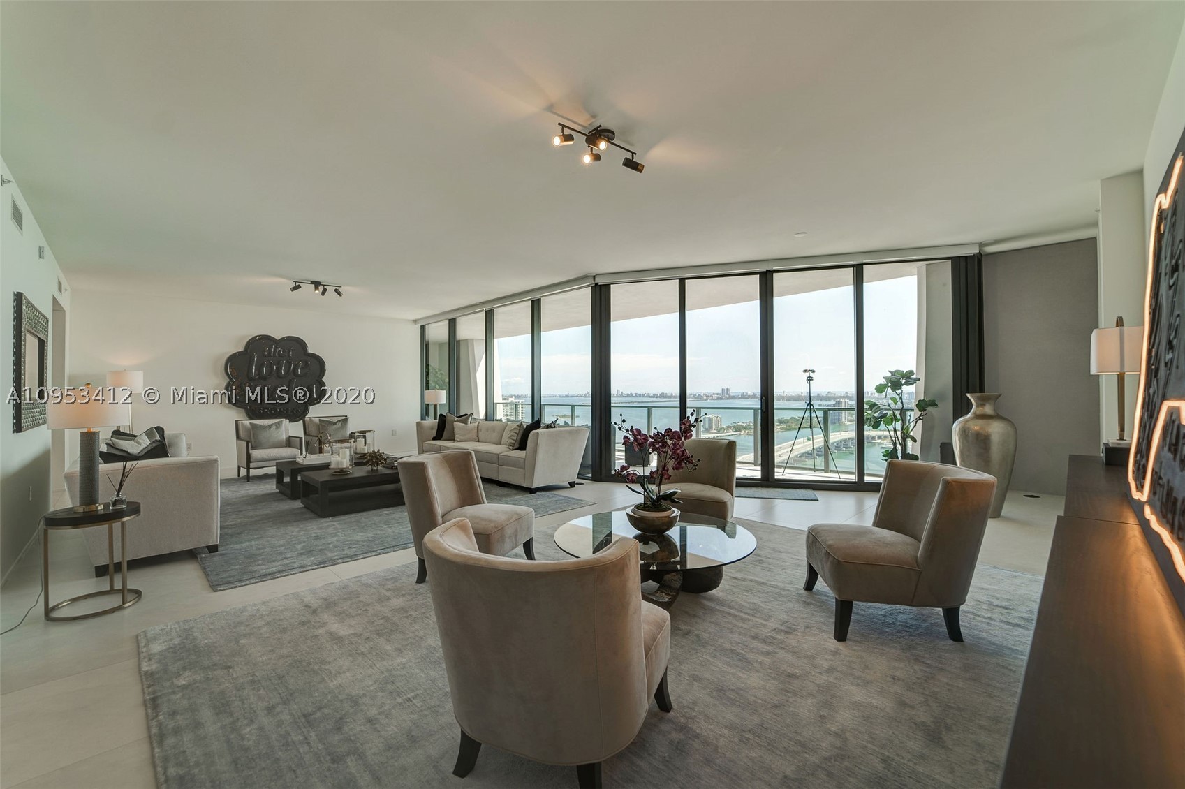 One thousand Museum, a triumphant expression of great design by legendary architect Zaha Hadid. This magnificent architectural landmark is Miami's most iconic building with only 84 impeccable curated homes offering an unprecedented level of white glove service and amenities. This residence is a Half floor featuring a flow through floor plan with unobstructed Biscayne Bay and Atlantic Ocean views including the port of Miami and cruise ships. This 4744 sf of pure modern luxury consists of 4 beds, 5.5 baths, including a beautiful Master suite as well as its large terrace off the great room.