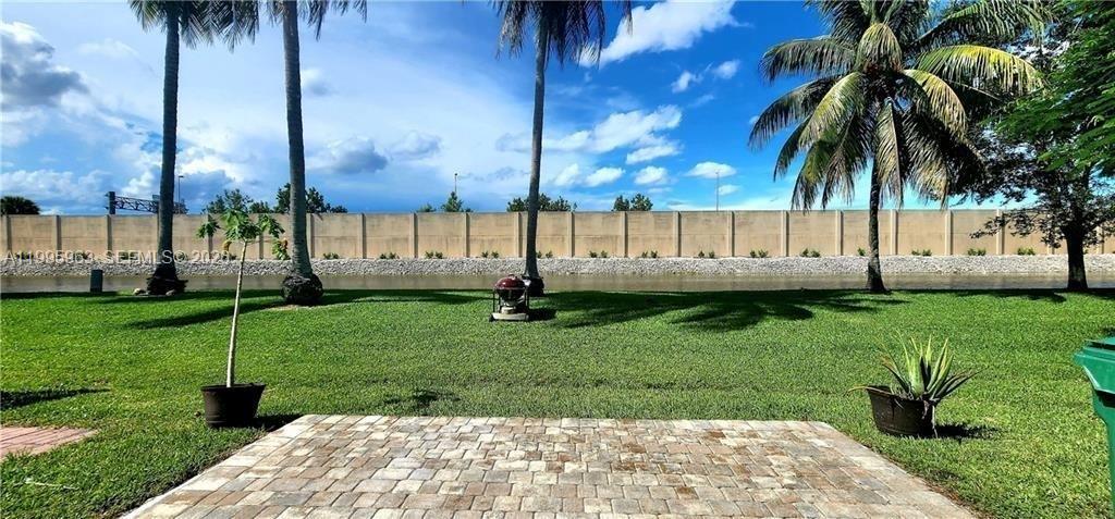 NEW ROOF COMPLETED! INVESTOR FRIENDLY! RENT IMMEDIATELY! LOW HOA! ALL AGES GATED COMMUNITY!

Beautiful 2-story townhouse located in the desirable Coral Reef Club community. This spacious home features 2 bedrooms plus a versatile den/office that can easily be used as a 3rd bedroom, 2.5 bathrooms, and a bright open floor plan with tile and wood flooring throughout.

Enjoy a screened patio with storage and a private backyard overlooking a peaceful canal, perfect for relaxing or entertaining. Additional features include accordion hurricane shutters, full-size washer and dryer, and two assigned parking spaces.

Residents enjoy community amenities including a pool, basketball court, and playground. Conveniently located near Sawgrass Expressway, shopping, dining, parks, and schools.

Excellent opportunity for both homeowners and investors in a community that allows immediate rentals.