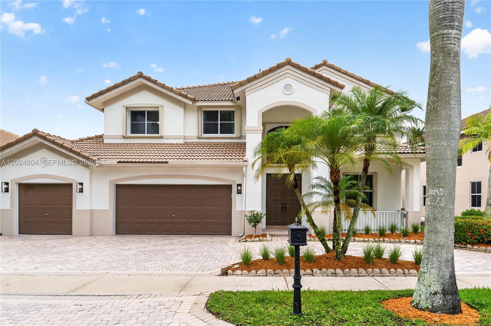 GORGEOUS LAKE FRONT HOME IN THE HIGHLY DESIRABLE GATED COMMUNITY OF  WESTON HILLS COUNTRY CLUB. RECENTLY REMODELED!! BRAND NEW FLOORS, BATHROOMS, AND KITCHEN!! THIS HOME HAS LOTS OF LIGHT WITH HIGH CEILINGS! NEW LED LIGHTS AND AN EXCELLENT FLOOR PLAN WITH SIX BEDROOMS AND FOUR FULL BATHS. FULL BED/BATH ON THE FIRST FLOOR. THE GOURMET KITCHEN HAS A LARGE CENTER ISLAND, QUARTZ COUNTERTOPS, STAINLESS STEEL APPLIANCES. FIVE SPACIOUS BEDROOMS UPSTAIRS WITH BEAUTIFUL MODERN FLOORS AND BATHROOMS. ONE BATHROOM HAS DOUBLE VANITIES AND THE OTHER IS A JACK AND JILL WITH TWO VANITIES ONE ON EACH SIDE OF THE BATHROOM WITH A TOILET AND SHOWER IN THE MIDDLE.  TONS OF CLOSETS AND STORAGE. FRESHLY PAINTED INTERIOR AND EXTERIOR. THIS HOME IS ONE OF THE VERY FEW HOMES IN THE SUBDIVISION WITH A LARGE CIRCULAR DRIVEWAY!  3 CAR GARAGE! FULLY FENCED WITH SCREENED PATIO AND CEILING FANS! GREAT FOR ENTERTAINING! THE HOME HAS FULL ACCORDION SHUTTERS PROTECTION. WALK TO COMMUNITY PARK, PLAYGROUND, BASKETBALL, AND SOCCER FIELD. THIS HOME WILL NOT LAST! CALL OR TEXT LISTING AGENT.