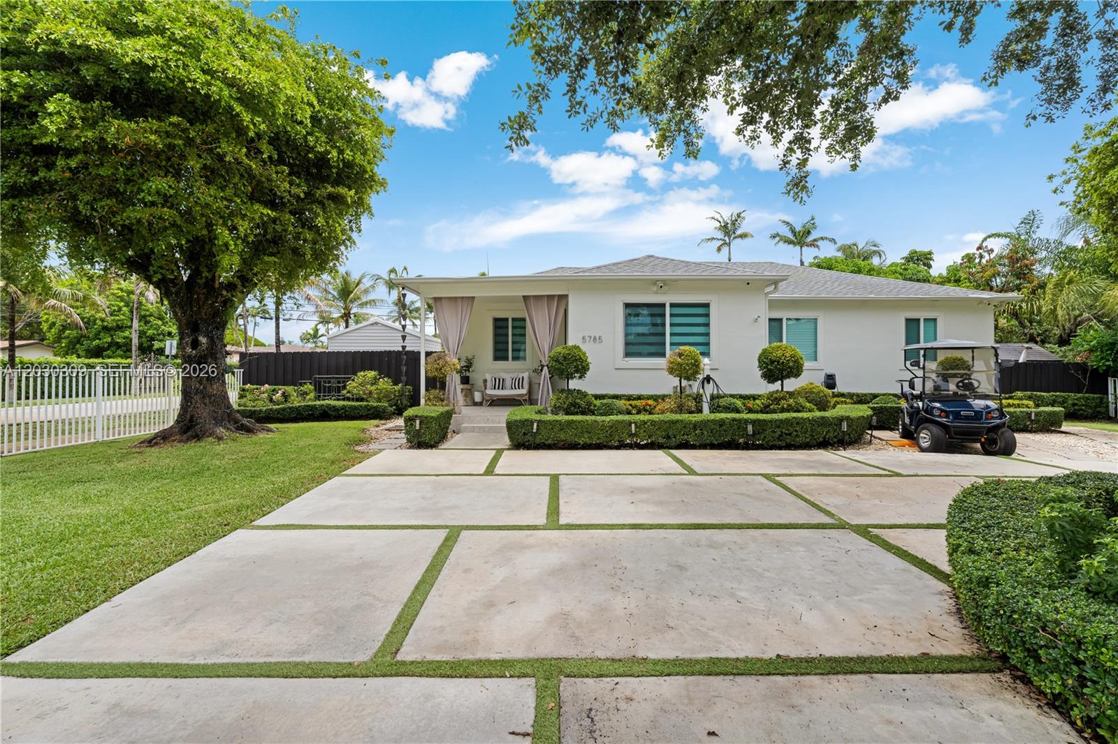 Exceptional gated one-story residence situated on a prominent corner lot in a peaceful residential enclave just moments from Coral Gables and South Miami. Beautifully updated throughout, this 5-bedroom, 4-bathroom home offers refined living spaces filled with natural light and designed for effortless entertaining and comfortable family living.  Some of the many upgrades include impact windows/doors, EV Charger, full house generator, state-of-the-art alarm system, and Ring Camera system.  Positioned on a generous 12,431 SF lot, the property features a beautiful and expansive backyard complete with a pool and covered outdoor kitchen, creating the perfect setting for entertaining guests or relaxing with family. A rare combination of privacy, location, and modern updates near premier schools, parks, restaurants, and shopping.
