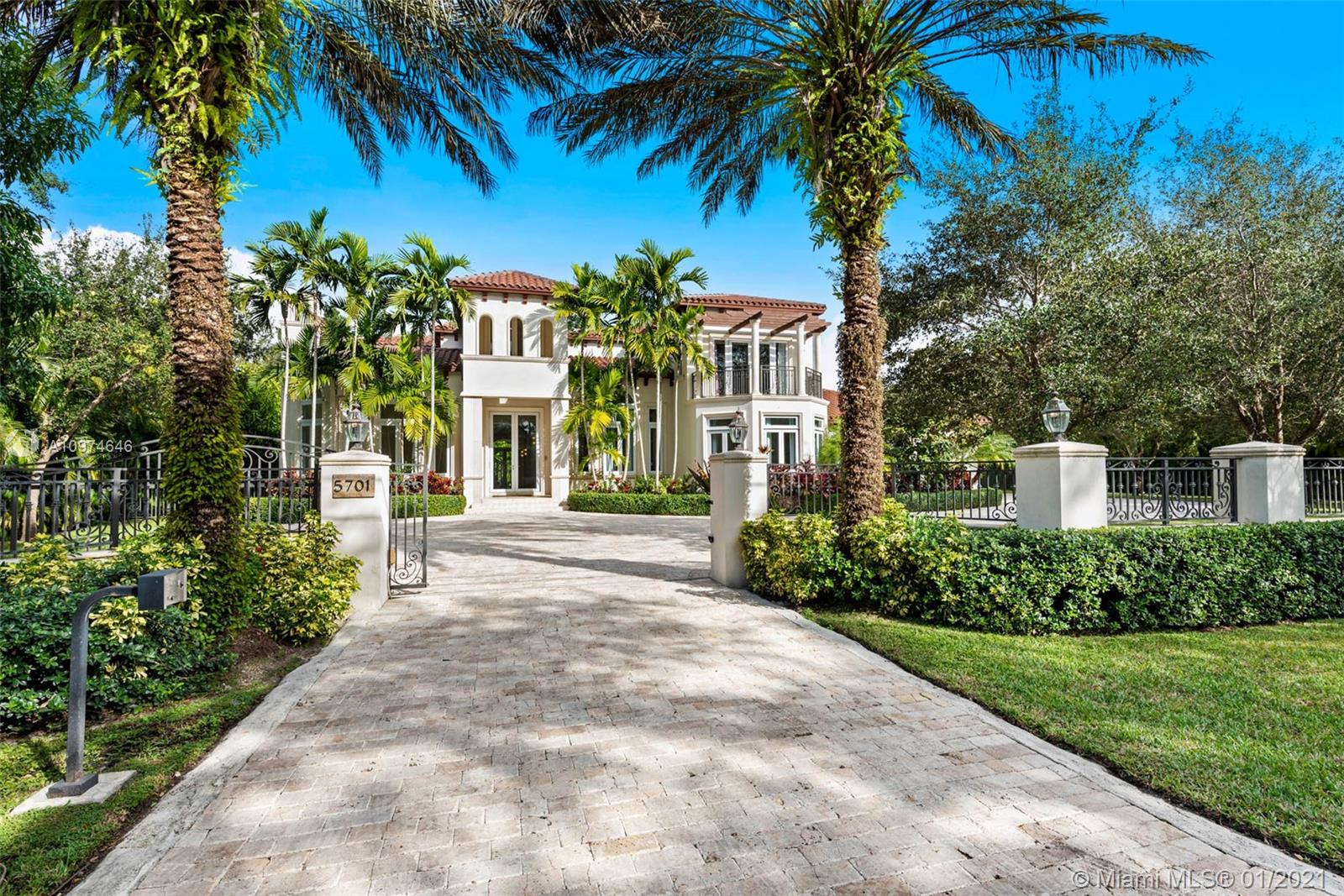 Superlative Mediterranean Masterpiece located on a stunning corner lot in coveted North Pinecrest. Awing interior with a soaring 2-story entry hall, huge windows, wood and marble floors, refined finishes & details. 5 bedroom, 5/2 bath perfectly spread designed over 7,628 SqFt of living area. Formal living and dining rooms, oversize chef’s kitchen with two cooking islands, WOLF and Subzero appliances and pool views is an epicurean dream. A spectacular oasis with heated salt water pool, expansive gazebo and patio with full summer kitchen – impeccably designed for entertaining inside & out. Full home generator, elevator, basketball court and three car garage complete this Pinecrest home.