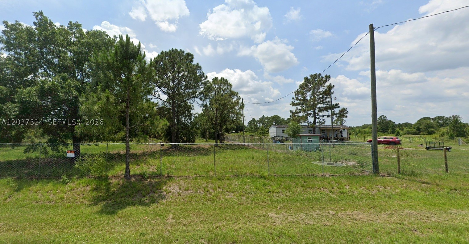 CLEAN, FENCED LOT WITH WELL AND GATE. Mobile homes and RV's are allowed. Just 20 minutes from Lake Okeechobee and downtown Clewiston and 45 minutes from Lazy Springs Recreation Park. Just over an hour from Naples and West Palm Beach. This land also has plans for a 3/2 single family home designed with extra details. All electric and water are also included in the plans.