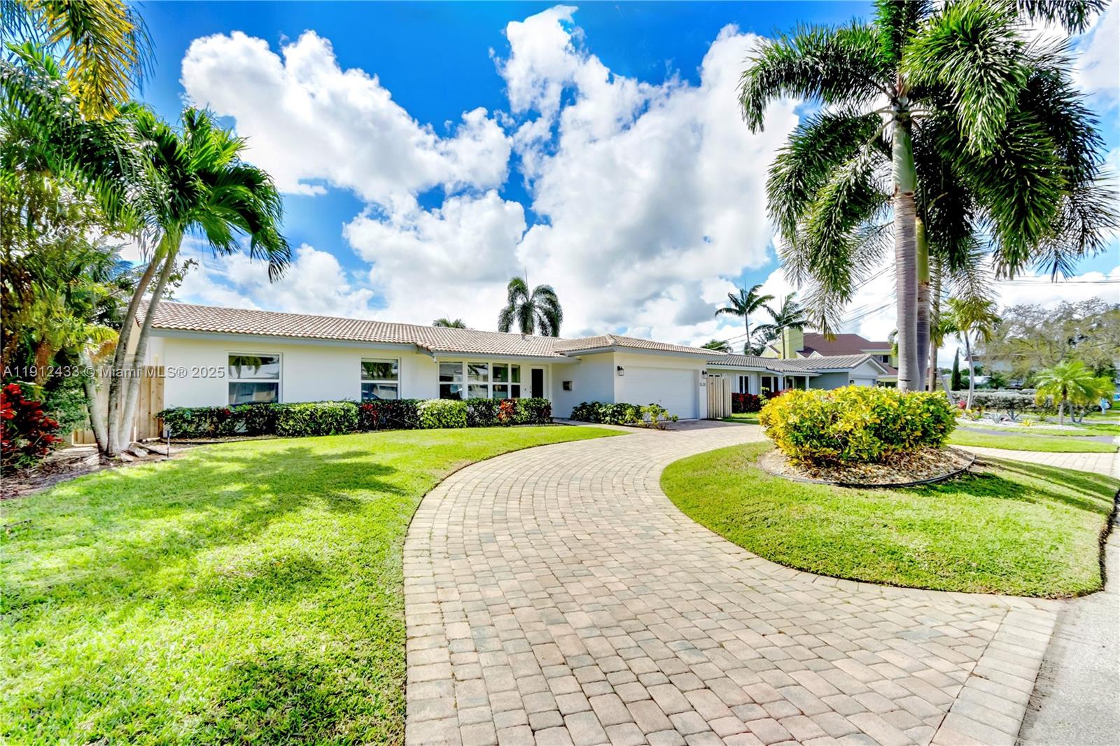 This 4-bedroom, 3-bathroom waterfront home has been thoughtfully updated with an emphasis on clean lines and high-quality finishes. The open-concept layout centers around a premium kitchen featuring quartz countertops, a large island, and custom built-ins.

Outside, the property is designed for waterfront living, with a 20-foot private dock offering access to the Intracoastal and the ocean. Additional highlights include a heated pool and an outdoor shower. The home is fully equipped with impact windows and doors and features a two-car paved garage. It also holds a short-term rental license, providing a rare level of flexibility.