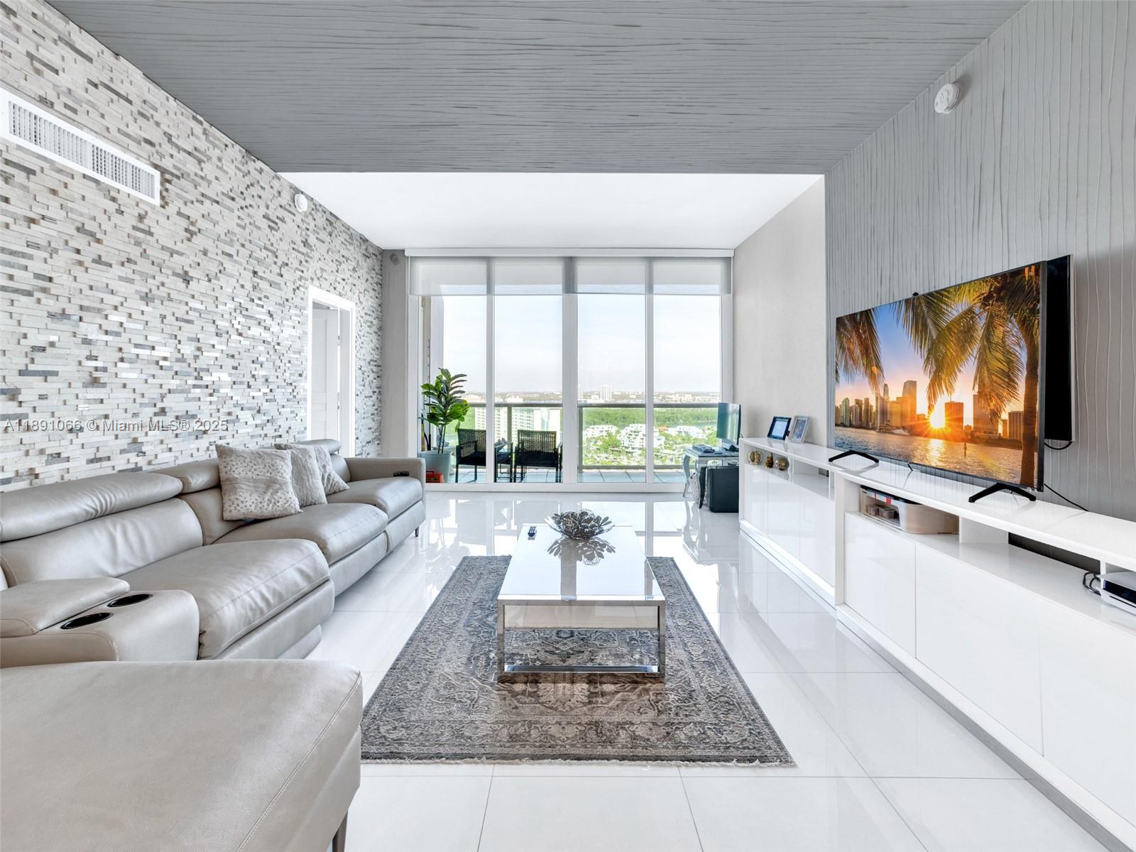 REMODELED AND PRICED TO SELL!!!  Welcome to your dream home in the sky! This exquisitely remodeled 2-bedroom, 2-bathroom penthouse offers unparalleled luxury and spectacular, unobstructed views of the Miami skyline. Boasting soaring 10-foot ceilings and a bright, open layout, this residence features a spacious balcony—perfect for soaking in breathtaking sunsets. Ideally situated in a prime location, this property is not only a dream home but also an exceptional investment opportunity. Residents enjoy top amenities, including a heated pool, fitness centers, tennis, a jacuzzi, a library, and a BBQ area. Just steps from the beach and minutes from world-class shopping, dining, and parks, Aventura Mall and South Beach, this penthouse embodies the ultimate Miami lifestyle. *Don’t miss out—schedule your private tour today! *