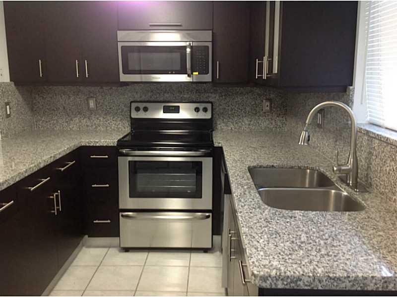 LOCATION, LOCATION, Just remodeled!  A 2 level townhouse, 2 bedrooms, 2.5 bathrooms, new kitchen with stainless steel appliances, new granite counter and new bathrooms, located in the gated community CHATEAUBLEAU VILLAS. Near major expressways and airport . Unit has a great floor plan, lots of light, with tile floors across first floor and Porcelain floors throughout bedrooms and staircase. Unit has lots of closet space, is freshly painted and move in ready. Near schools, shopping and restaurants.