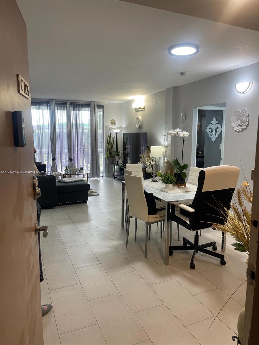 Beautiful remodeled first-floor unit that has a custom built kitchen with stainless steel appliances and new tile flooring throughout. Enjoy the garden view with the enclosed screened balcony. Well kept community with amenities like Pool and BBQ/picnic area. The unit has 2 parking spaces, laundry room is steps away. Near A+ schools(Bob Graham k-8, Country Club Middle and Barbara Goleman Senior High).
