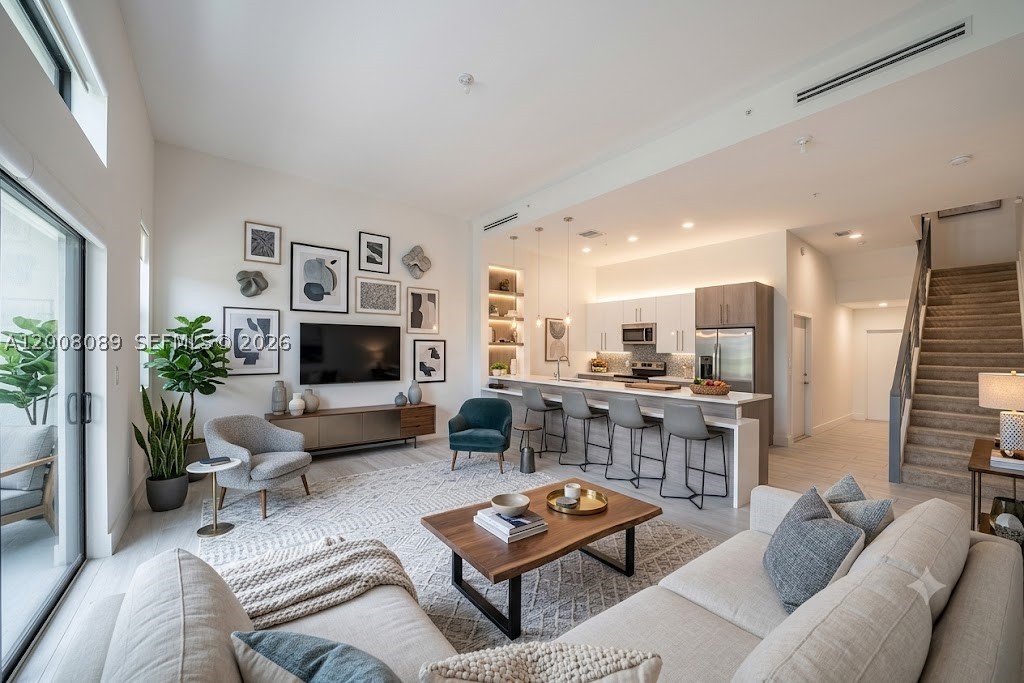 This beautifully designed 2-story townhouse is located in the gated community of Strata at Plantation, offering a perfect blend of comfort, modern design, and strong long-term value.

Featuring high ceilings and an open-concept layout, the unit feels bright, spacious, and functional. The kitchen is equipped with sleek European cabinetry, stainless steel appliances, and a central island—ideal for both daily living and entertaining.

The home includes contemporary finishes, designer-style bathrooms, ceramic tile flooring on the main level, and plush carpeting upstairs. The primary suite offers a private balcony and a spa-like bathroom, creating a comfortable retreat. Secondary bedrooms are filled with natural light, making the space feel warm and inviting.

Sliding glass doors open to a garden area, adding an indoor-outdoor living feel. The property is located close to the clubhouse and within a well-maintained, secure community.

Strong rental demand in the area makes this property attractive for both end-users and investors. Easy to rent, easy to maintain, and positioned in a growing submarket.