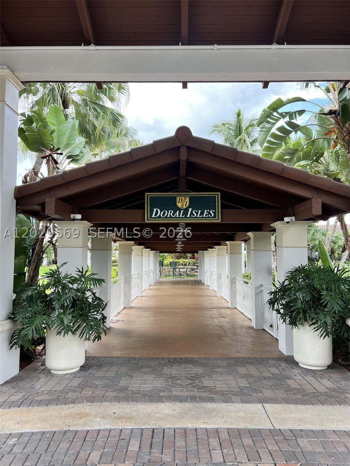 Stunning corner-unit residence located in the highly sought-after gated community of Doral Isles. This spacious 3-bedroom, 2-bath home features an open and bright floor plan with abundant natural light, breathtaking lake views, and spectacular sunset exposure. Enjoy additional living space with an enclosed balcony and a screened front porch, perfect for relaxing or entertaining. The oversized primary suite offers a walk-in closet, dual vanities, and a Roman tub. Additional features include a separate laundry room, assigned parking, and generous living areas throughout. Residents enjoy access to Doral Isles’ world-class resort-style amenities, including multiple pools, a fitness center, tennis courts, soccer and baseball fields, beach volleyball, and jogging trails. A+ Schools.
