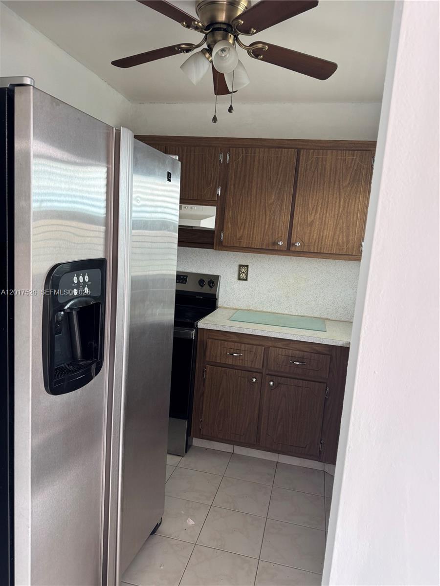 Bright and spacious 1BR/1BA condo in the prestigious 55+ community of Sunrise Lakes.  This light-filled unit features tile flooring throughout, Hurricane-impact windows for peace of mind, a fully just renovated bathroom and a Titan tankless water heater for added efficiency and protection.  Maintenance includes: water, cable, internet, exterior insurance, a service contract covering plumbing, appliances and A/C-offering true peace of mind with one simple call for repairs; full access to clubhouse amenities.  Enjoy a beautiful clubhouse, tennis courts, outdoor and heated indoor pools, billiards, theater, ballroom, fitness center and more.  Prime location near dinning, highways and 20 minutes from the beach.  Experience the best of Florida living!
