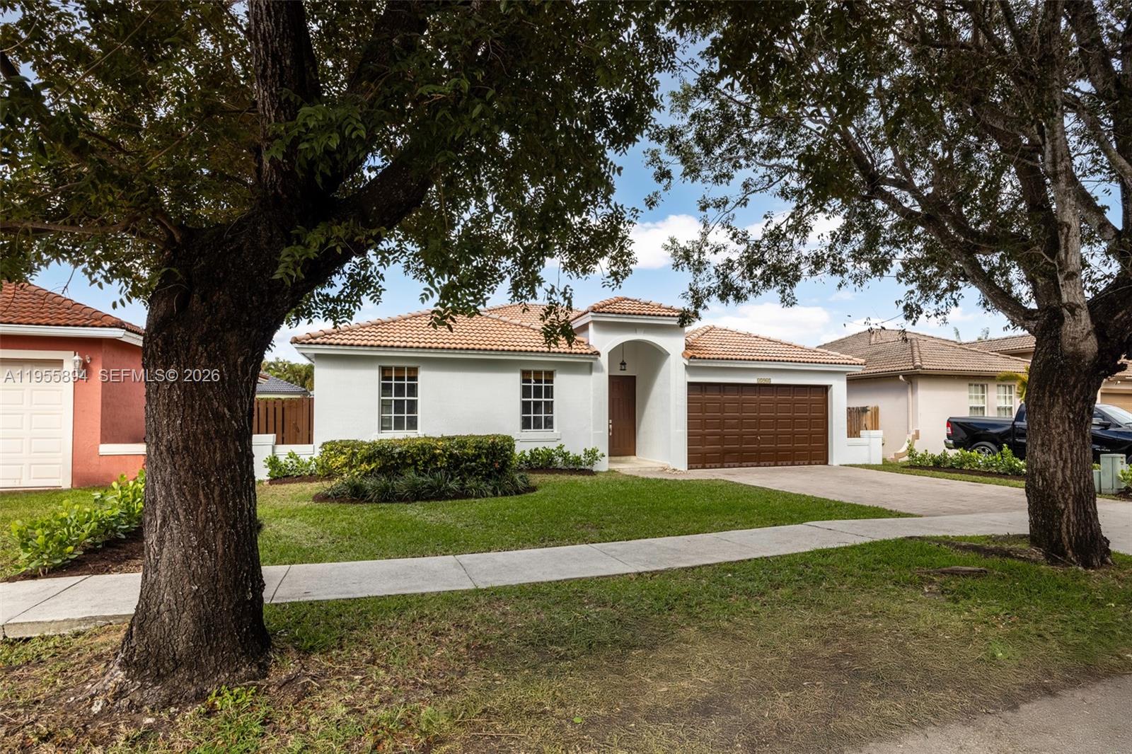 Tastefully updated 4-bed, 2.5-bath pool home in the sought-after Garden Hills community with no HOA. Set on a quiet street, this move-in-ready residence offers 1,962 SF of bright, open living with high ceilings and a flexible layout that includes formal living, dining, and family rooms. The updated kitchen features granite countertops, stainless steel appliances, and ample cabinetry, perfect for everyday living and entertaining. The spacious primary suite is a true retreat with double doors opening to the backyard, two walk-in closets, and a spa-style bath with dual vanities, soaking tub, and separate shower. Recent upgrades include a newly painted exterior, refreshed garage and front doors, and lush clusia hedges for enhanced privacy and curb appeal. The backyard has been thoughtfully improved with fresh river rock and a professionally cleaned, sealed, and painted pool deck—creating a sleek, low-maintenance outdoor setting. Additional highlights include a two-car garage, powder bath, window treatments, and hurricane shutters. Ideally located near parks, top-rated schools, shopping, and dining, this home blends comfort, style, and convenience in one of West Kendall’s most desirable neighborhoods.
