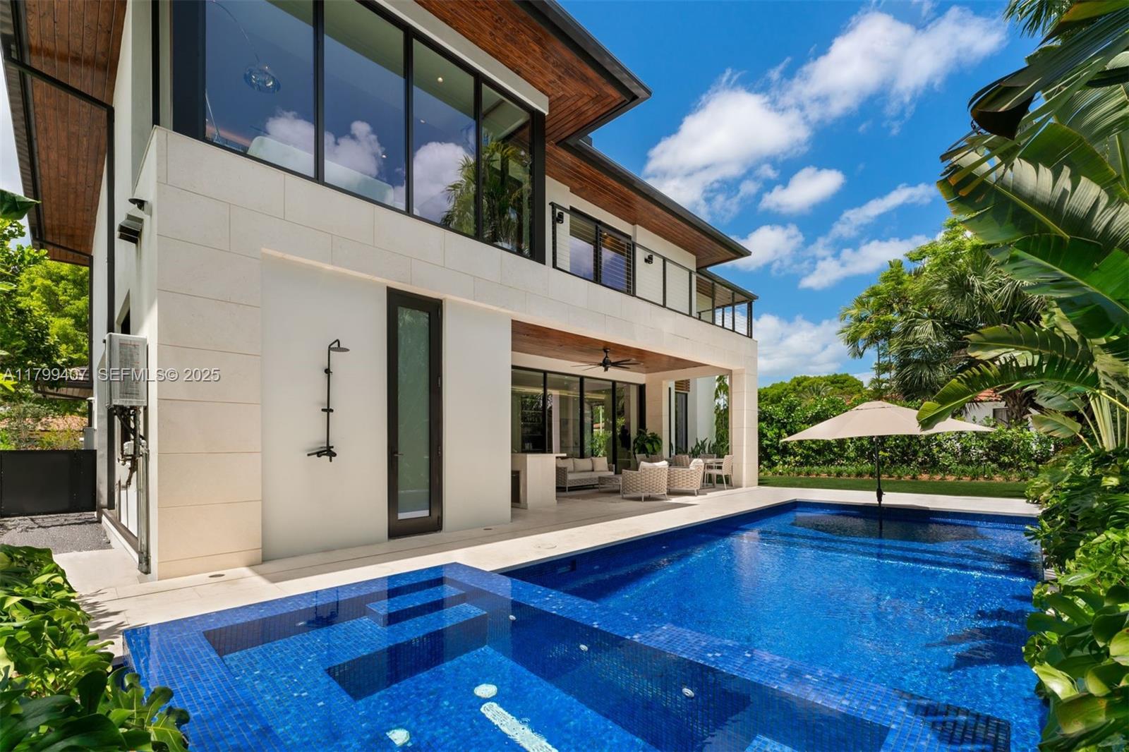 Welcome to 23:23 in the Roads—a bold architectural statement where design, technology, and nature coexist in harmony. Created by renowned architects Felipe Trelles and Jennifer Salman with Gil Development, this newly built 5-bedroom, 4.5-bath residence spans nearly 4,000 sq ft, extending to 4,800 with a garage and terrace. Maura Rossi imbues the home with organic elegance and warmth. Ketra lighting mimics daylight, and Lutron shades optimize lighting and privacy. The chef’s kitchen features a double island and wet bar. Immersive audio and Coastal Source speakers enhance the experience. Features include motion lighting, water filtration, 4K security, and Fortinet Wi-Fi—all controlled via one app. Located minutes from Brickell, enjoy serenity and world-class dining, culture, commerce access.