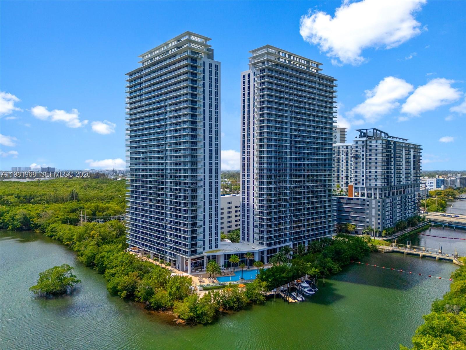 Experience elevated living in this stunning corner Lower Penthouse featuring 3 bedrooms, 3 full bathrooms, plus a versatile den, located in one of the most desirable lines at the luxury waterfront community The Harbour in North Miami.

This beautifully decorated residence offers a spacious and thoughtfully designed layout, complemented by high-end custom-made furniture created specifically for the apartment, which can be negotiated as part of the sale. The home features a modern open-concept kitchen equipped with premium LIEBHERR and SMEG appliances, seamlessly flowing into the dining and living areas, perfect for both everyday living and entertaining.

Floor-to-ceiling windows fill the space with natural light and open to a generous private balcony, where you can enjoy breathtaking views of the Bay and the iconic Sunny Isles skyline.

Residents of THE HARBOUR enjoy an exceptional lifestyle with resort-style amenities, including concierge service, spa, state-of-the-art fitness center, pool, kids room, tennis and basketball courts, outdoor playground, picnic areas, bikes on site, valet service, and much more.

A rare opportunity to own a designer Lower Penthouse in one of North Miami's most sought-after waterfront communities.  Price to SELL!