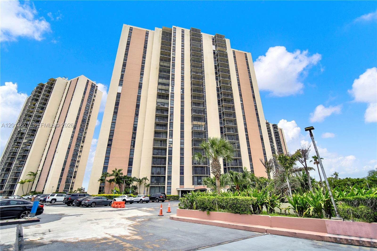 Welcome to elevated South Florida living in this beautifully updated, move-in-ready residence featuring breathtaking panoramic golf and skyline views from an expansive screened balcony. This spacious and light-filled condo offers the perfect blend of comfort, style, and value with the special assessment already PAID IN FULL for complete peace of mind.

Step inside to discover a bright open-concept layout with oversized living and dining areas, floor-to-ceiling natural light, and modern finishes throughout. The residence is offered FULLY FURNISHED, making it ideal for full-time living, a seasonal retreat, or an effortless investment opportunity.

The oversized screened terrace is the true showpiece, perfect for morning coffee, sunset cocktails, or simply enjoying endless unobstructed views of the lush golf course and city skyline.