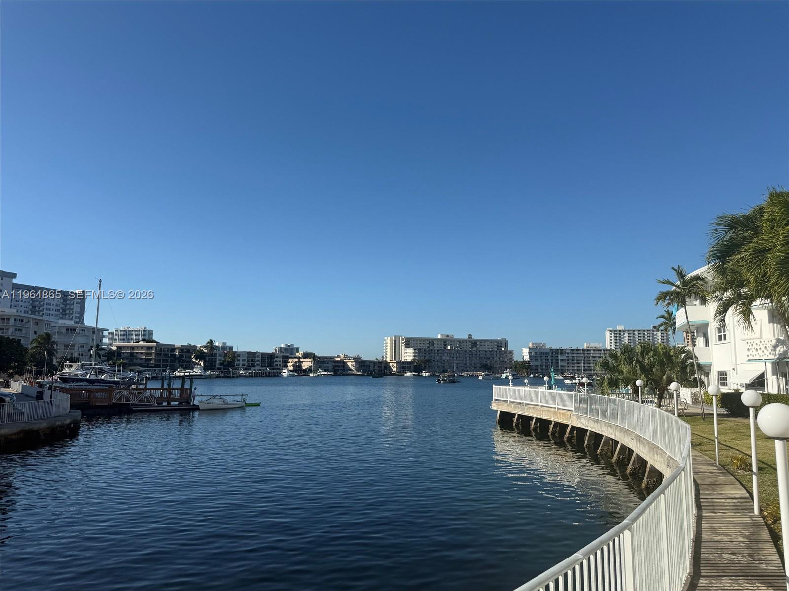 Enjoy relaxed waterfront living in this first-floor 1-bedroom, 1-bath residence ideally positioned along the Intracoastal in Hallandale Beach. Offering peaceful marina and water views just one block from the ocean, this home delivers a rare combination of location, convenience, and coastal charm. . A generously sized private balcony provides the perfect setting to enjoy ocean breezes, passing boats, and South Florida sunsets. 

Situated within a quiet and well-cared-for 55+ waterfront community, residents enjoy amenities including an Intracoastal-front pool, picnic and BBQ areas, laundry facilities, additional storage, and dock access available by waitlist. The building has completed electrical recertification and continues to show long-term stability with a seawall completed in 2019, roof completed in 2015, and reserves exceeding 10%. Maintenance fees remain among the lowest for Intracoastal properties in the area. The building lobby includes elevator access for added convenience. Additional features include one assigned parking space directly in front of the unit, ESA animals permitted, and a no-leasing policy that helps maintain a peaceful residential environment while allowing family visits. Conveniently located near the beach, shopping, dining, Gulfstream Casino, and Aventura Mall. Furniture negotiable. Cooperative apartment with proprietary lease.