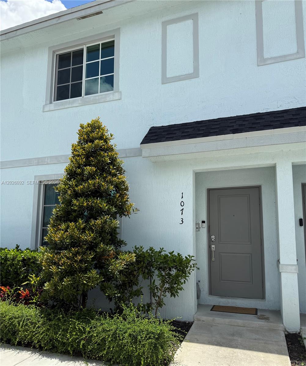 Live in one of Florida City’s newest communities in this stylish and move-in ready 3/3 townhome offering comfort, space, and modern convenience. Built less than two years ago, this residence features a bright open layout, oversized kitchen island, spacious bedrooms, walk-in closet, private fenced patio, and contemporary finishes throughout. One bedroom and a full bathroom are conveniently located downstairs — ideal for guests, extended family, or a home office setup.  The community offers a peaceful residential feel with beautifully maintained grounds and a neighborhood playground, making it ideal for those looking for newer construction and a quieter lifestyle while still being close to shopping, dining, major expressways, and everyday conveniences.