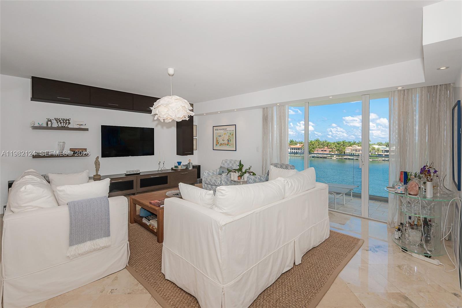 This masterfully curated 2BR/2BA residence spans 1900 SF of pure sophistication, featuring a professional "Contemporary Transitional" design that perfectly balances modern edge with timeless warmth. Step inside to an expansive area with floor-to-ceiling glass that frames unobstructed, panoramic water views from every vantage point.Open kitchen, miele apliances, spacious and open,center island, self enclosed  washer,dryer. Heated pool with pool service for year round relaxation, jacuzzi, on site restaurant, children's playroom, billiard room, theater room, exercise room, party rooms and more. Gym and Free fitness classes including Yoga, Pool Aerobics and Zumba classes. 24 hr. security and valet for comfort and peace of mind.. Close to great shopping, fine dining, beautiful beaches, both Int'l airports, and across from Turnberry PGA world class golf course. It doesn't get much better than this. Don't miss this opportunity to own a piece of paradise in your own backyard!