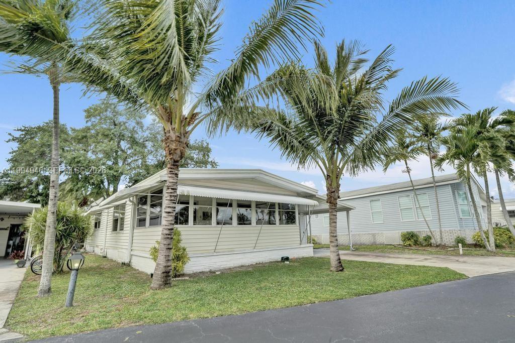 Renovated Mobile home in Golfview Estates.  Great storage and laundry room built in 2025 makes this home complete and very functional.  2 bed/2 bath and large florida room full of natural light. A must see with Great move in ready PRICE!  GOLFVIEW ESTATES offers rented lots and mobile homes have a regular monthly rent of $980 and protected right of first refusal for all renters.