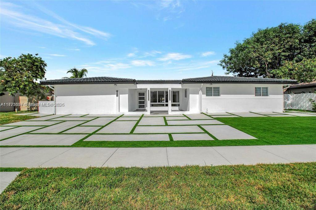 Welcome to this beautifully renovated waterfront estate in the prestigious gated community of Golden Isles. Set on an expansive 12,750sf lot with 85 feet of pristine water frontage, this exceptional property is a true gem for those seeking luxury coastal living.This stunning home features five spacious bedrooms and four elegantly designed bathrooms, perfectly blending style and functionality. The open-concept layout is filled with natural light, complemented by high-end finishes and modern touches throughout. Outdoors, a beautiful pool overlooks the serene Intracoastal Waterway, creating the perfect setting for entertaining or simply relaxing.Owner legally added additional 1,090sf to the existing property