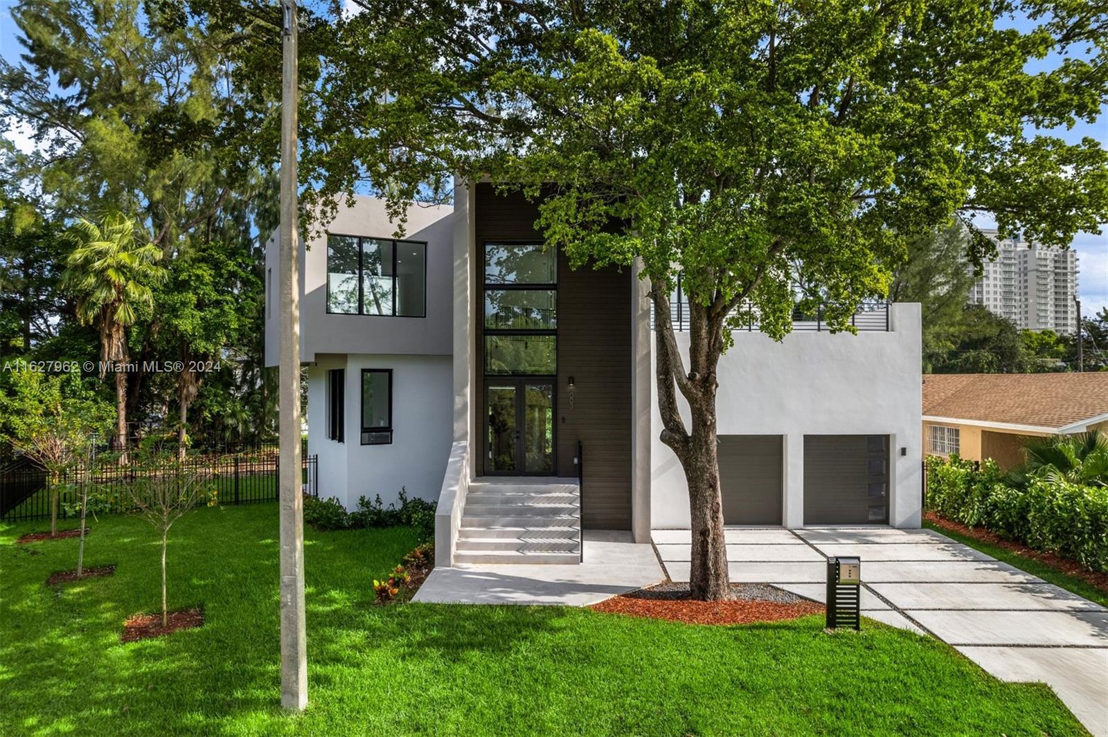 Discover your dream home in serene Shorecrest/Miami Shores! This contemporary house, with four bedrooms and three bathrooms, exemplifies modern architecture. Featuring spacious high ceilings, a two-car garage, hurricane-proof windows, and a stunning open floor plan with over 800 SQFT OF ADDITIONAL TERRACES—perfect for hosting gatherings and admiring sunsets. The backyard is adorned with lush tropical landscaping and a privacy fence, creating a peaceful oasis. Pool is under construction.