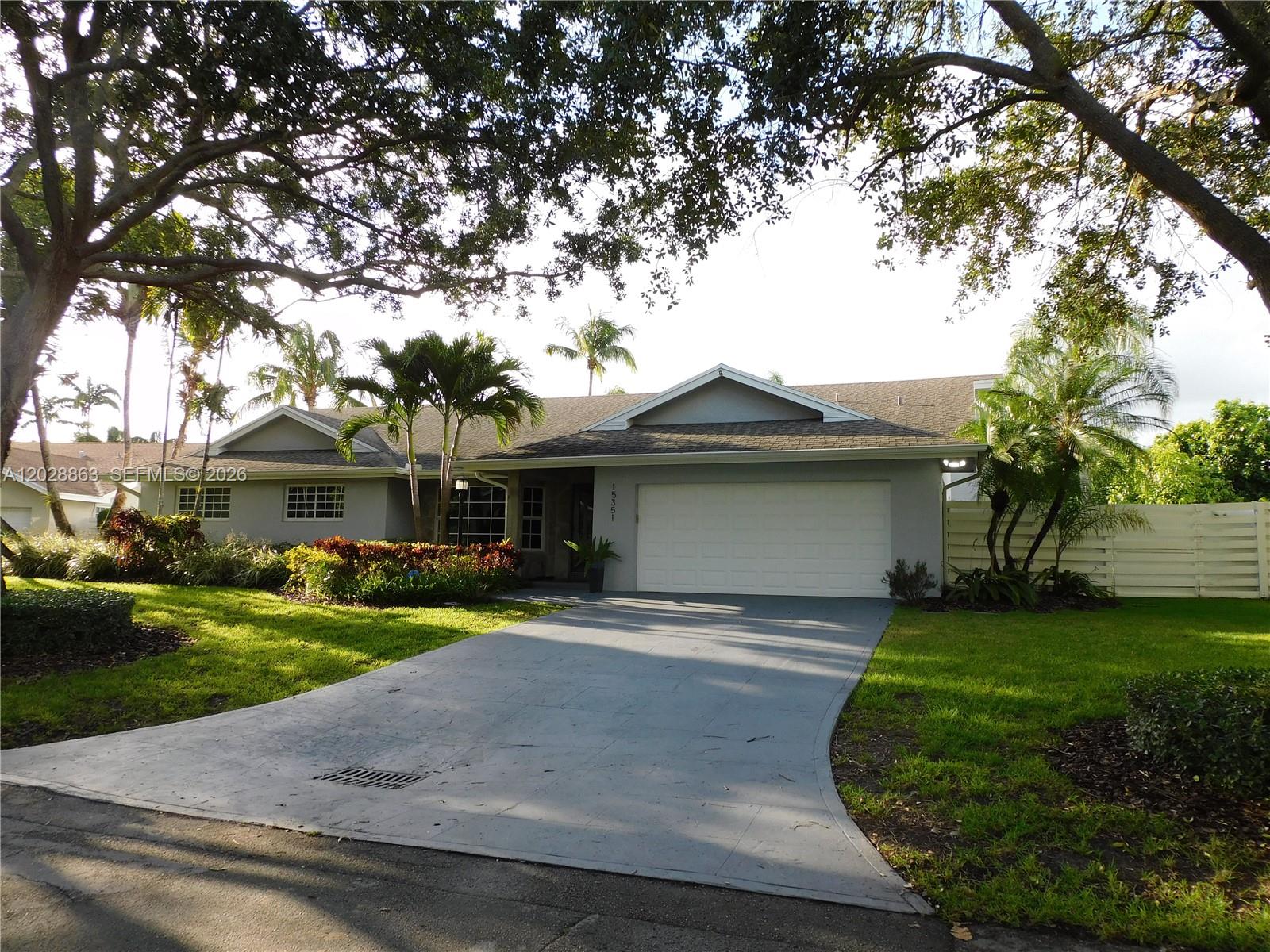 Country Walk Estate at its best. CBS construction featuring 4 bedrooms, 2.5 bathrooms, an oversized family room, and a 2-car garage. Full impact windows and doors throughout. Interior features 24" x 48" tile flooring throughout and wood flooring in the primary & fourth bedroom. Spacious kitchen with wood cabinetry, pull-out shelves, quartz countertops & backsplash, and a snack counter. Large picture window overlooks the renovated pool, marble deck, and lush landscaping.
Additional features include plantation shutters, crown molding, 6-inch baseboards, rain gutters, automatic well-fed sprinkler system, alarm system, interior laundry room with abundant cabinetry, and quartz countertops. Pride of ownership is evident throughout. Located in a well-established community with convenient access to schools, parks, shopping, and major roadways.