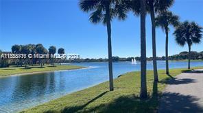 Enjoy a pleasant lake view from your living area. Spacious 2 bedrooms and 2 baths, enclosed screened balcony, laminated flooring, high ceiling in living area, quartz kitchen countertops, fully equipped kitchen with Gas stove, washer and dryer inside unit, walking closet space in master room. The unit is next to the clubhouse including a gym and activity room. Two assigned parking spaces. The unit is on the 3rd-floor walk-up. This complex is located close to schools, Kendall Baptist Hospital, and shopping centers. Enjoy direct access to Hammocks Lake to enjoy a pleasant walk.