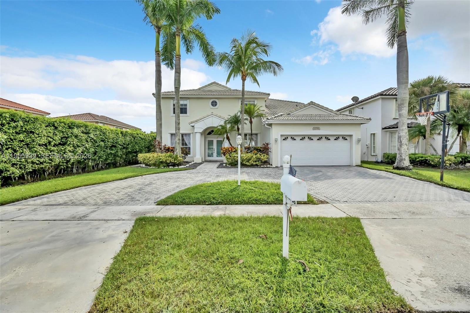 Welcome to this stunning 2-story, 5-bed, 3-bath home with a 2-car garage and breathtaking lake views in the beautiful neighborhood of Boca Winds. With the master and 3 bedrooms upstairs, while 1 bedroom is downstairs. The spacious living areas are perfect for entertaining, and the gourmet kitchen features sleek countertops and stainless steel appliances. The large master suite includes a walk-in closet and luxurious ensuite bath. Outdoors, enjoy the patio and pool/hot tub with direct lake views. The community offers amenities such as a pool, tennis and basketball courts, and a playground. Located in a desirable neighborhood close to top-rated schools, major plazas, and publix. This home offers both comfort and convenience. ROOF IS 2025.
