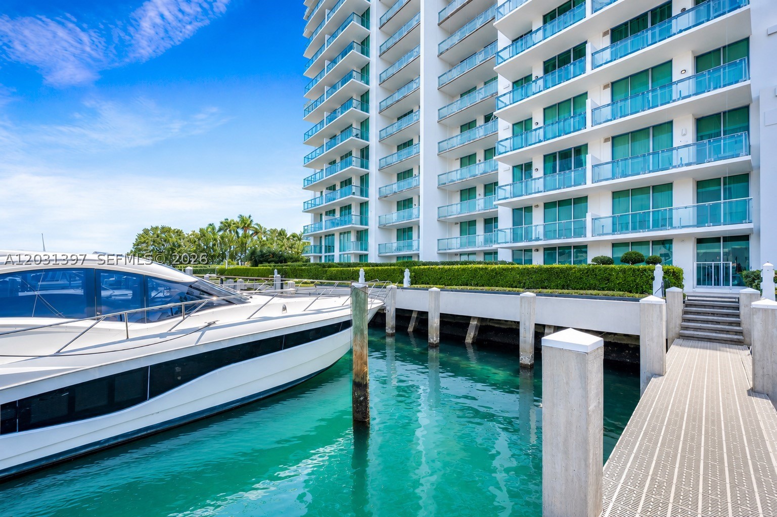 TRUE TROPHY PENTHOUSE WITH 20 FOOT CEILINGS, 2,498 LIVING SQFT AND INCLUDES TWO BOAT SLIPS- 4 Beds |3.5 Baths -  This is the kind of place most Miami buyers spend years looking for — a two-story, split-level waterfront residence sitting on the 18th floor of Eloquence on the Bay. The home spans two full levels with soaring ceilings, floor-to-ceiling glass, and four private terraces that capture sunrise over the water and sunset over the city. The open living and dining areas flow naturally, and the loft upstairs works perfectly as a fourth bedroom or private retreat. Every bedroom has its own en-suite bath and private balcony access. Marble and ceramic tile flooring throughout. Dolphins and manatees pass by the marina in the mornings. The water is visible from nearly every room. The building delivers a full resort experience: private marina, luxury pool and jacuzzi, 2-story fitness center, yoga studio, tennis and basketball courts, waterfront walkway, kayak, paddle-board and bike storage, EV charging, and 24/7 concierge and security. Two assigned covered garage spaces included. Tucked at the quiet end of Harbor sland in North Bay Village — one of Miami's last emerging waterfront communities, with new restaurants, retail, and major developments already underway. Minutes from Miami Beach, the Design District, top-rated schools, MIA, and Fort Lauderdale airports.  A rare opportunity to own one of Miami's most unique waterfront residences.