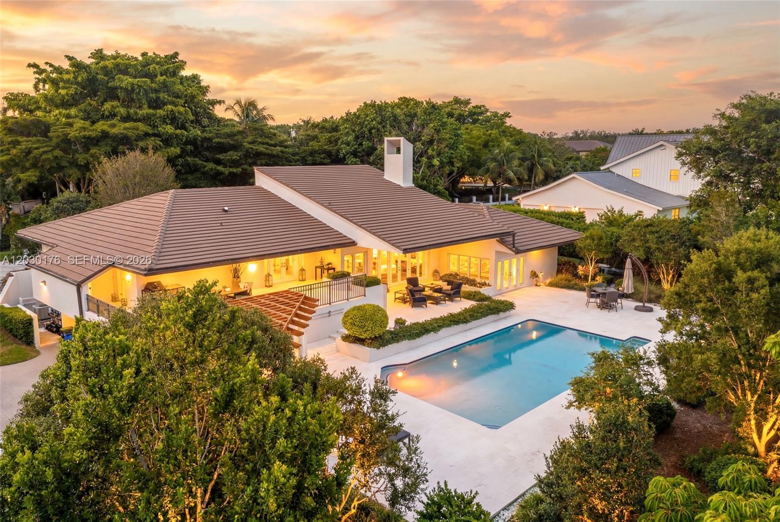Experience timeless elegance in this 5 bed + detached cabana, 5.5 bath estate on an oversized 28,900 SF lot in prime Coral Gables location! Character and quality define every detail, from soaring ceilings & white-washed cedar wood accents to a grand living room with walnut/travertine bar & wood-bruning fireplace. Renovated chef's kitchen features Miele and Sub-Zero appliances with Calacatta gold marble counters and large walk-in pantry. Enjoy a massive primary suite with spa-like bath, large walk-in closet & private garden. Outdoors, resort-style living awaits with a saltwater pool, expansive deck, generous yard, and extra room with pool bathroom. Impact windows/doors & 2023 Roof. Oversized AC'd garage with extra storage. Near top schools, dining, and shops. Cocoplum lifestyle without the HOA!