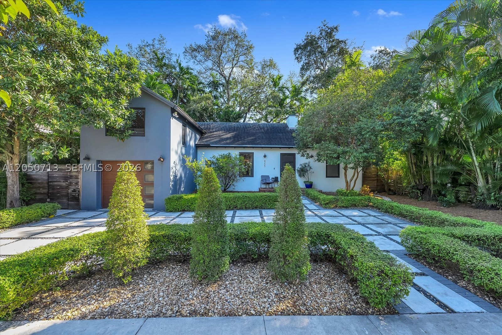 Stylish, fully furnished 3BD 2.5BA two-story smart home thoughtfully designed showcasing layered architectural details that create a warm and inviting atmosphere throughout from the vaulted ceilings, exposed beams and decorative fireplace. Open living spaces provide a seamless flow for everyday living and entertaining. The primary suite offers a spa-like retreat with a private, relaxing layout. The kitchen is designed for both function and entertaining, featuring modern finishes and ample storage. Step outside to a lush, gated backyard complete with a built-in outdoor kitchen, ideal for hosting gatherings or enjoying quiet evenings at home. 1 car garage and home gym. Close to beaches, shops, restaurants and major highways.