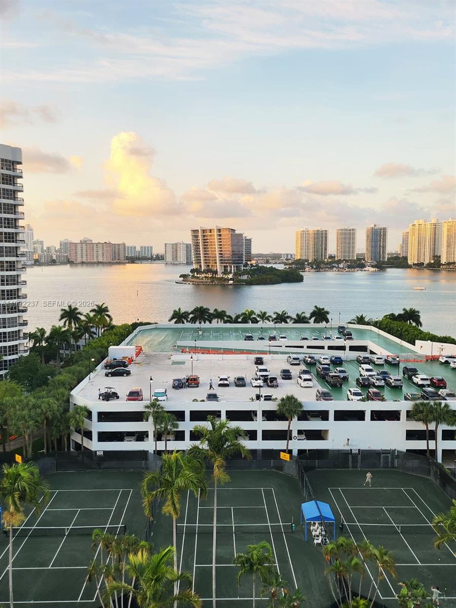 Mystic Pointe Unit 1201 – Spectacular residence located on the 12th floor featuring breathtaking panoramic views of the water and city skyline, offering spacious interiors, a functional layout, and abundant natural light; the unit includes an equipped kitchen, comfortable living areas, and a private balcony perfect for enjoying beautiful sunsets. Located in an exclusive Aventura community with resort-style amenities including a pool, fully equipped fitness center, tennis courts, 24/7 security, and a private marina, making it an excellent opportunity for both living and investment, with a prime location close to shopping centers, restaurants, and beaches.