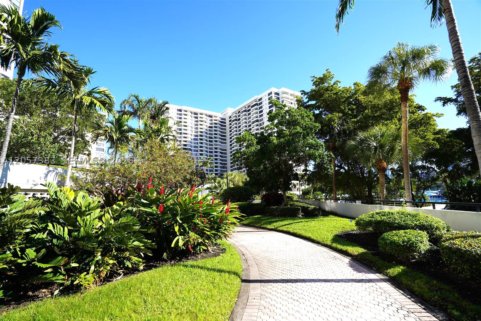 Spacious 2-bedroom, 2-bath residence in the sought-after Olympus Condominium on Three Islands. This bright unit features an open layout, generous living and dining areas, and a private balcony with beautiful marina and water views. Remodeled kitchen and master suite, while the spacious primary suite includes a walk-in closet and en-suite bath.

Enjoy resort-style living with exceptional amenities, including two heated pools, a state-of-the-art fitness center, tennis courts, marina, BBQ area, sauna, valet, covered parking, 24-hour security, and beautifully landscaped grounds.

Ideally located just minutes from Hallandale Beach, Gulfstream Park, Aventura Mall, restaurants, shopping, casinos, and Fort Lauderdale Airport. A fantastic opportunity to update and customize this waterfront residence to your own taste while enjoying one of the best locations in Three Islands.