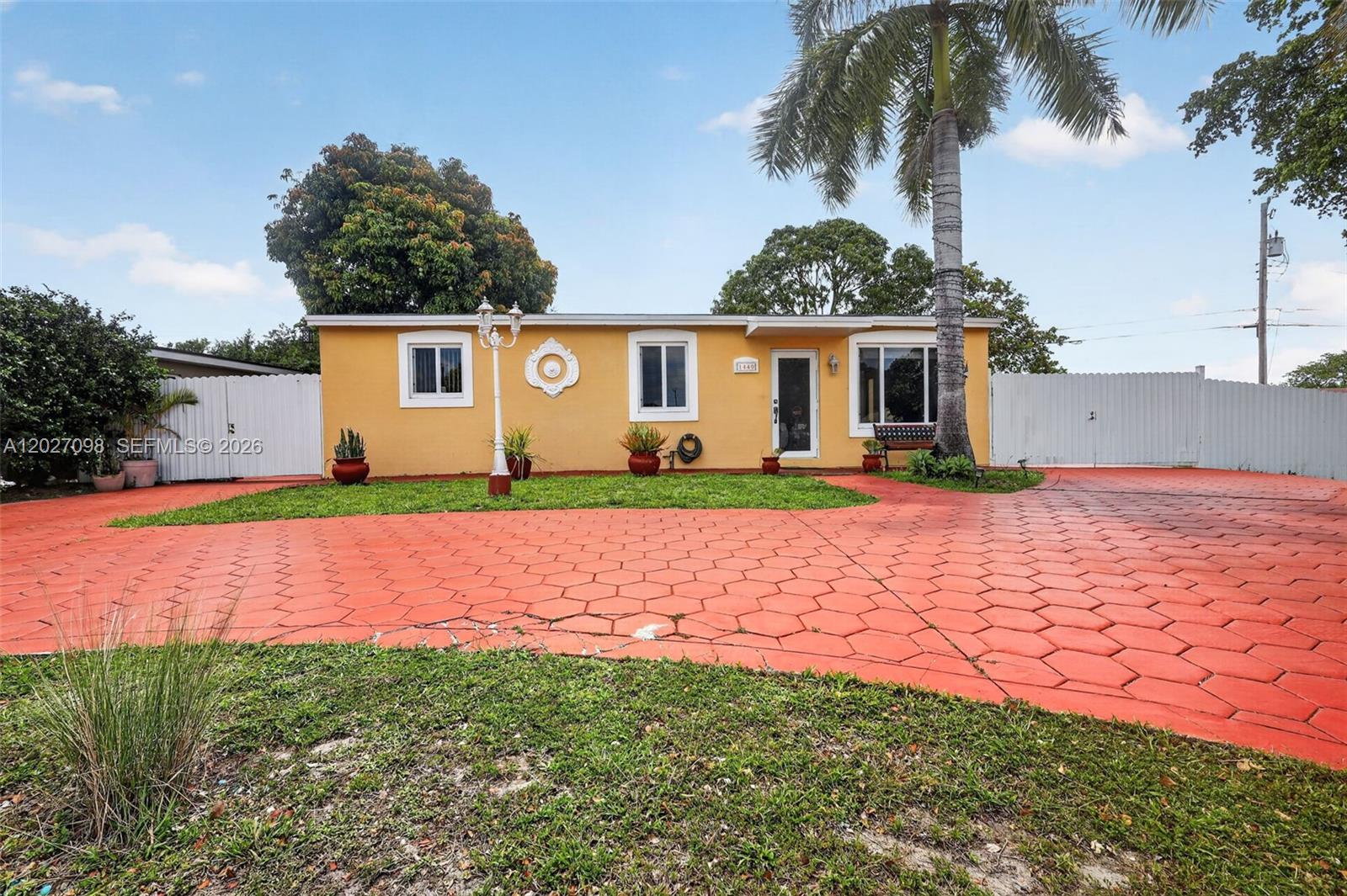 Beautifully maintained corner-lot residence offering comfort, functionality, and peace of mind in the heart of Hollywood. Situated on an oversized 7,751 sq ft lot, this 3-bedroom, 2-bath + DEN home blends everyday practicality with major-value improvements already completed. Designed for today’s Florida lifestyle, the property features a NEW ROOF (2024), impact windows and doors, updated electrical panel (2024), newer A/C (approx. 5 years), updated air ducts, water heater, and additional system upgrades that provide long-term value and insurance-friendly benefits. The expansive corner lot offers exceptional outdoor space, circular driveway, RV/boat parking potential, and room to entertain or personalize. Conveniently located near major highways, shopping, dining, parks, schools, and everyday conveniences. A rare opportunity to own a move-in ready home with the major-ticket items already done.