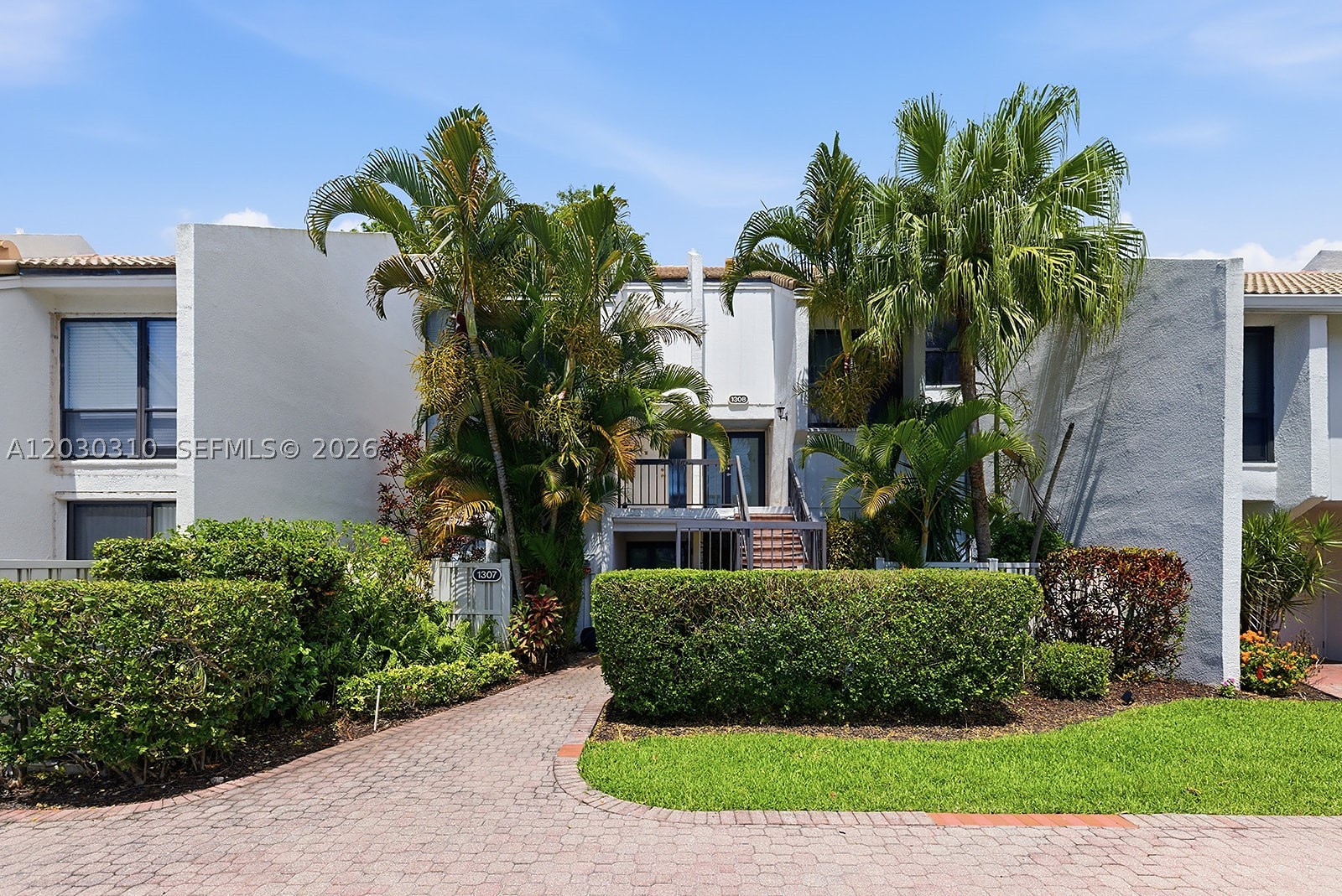 Welcome to Boca West Country Club, one of South Florida’s premier private club communities. This charming 2-bedroom, 1.5-bath residence at 1309 Bridgewood Drive offers comfortable living in a tranquil setting surrounded by lush landscaping and resort-style amenities. The home features a functional floor plan, spacious living and dining areas, abundant natural light, and a private outdoor space perfect for relaxing or entertaining. with access to world-class golf, tennis, pickleball, fitness facilities, dining, and social activities. An excellent opportunity to enjoy the Boca West lifestyle in the heart of Boca Raton. Membership required.
