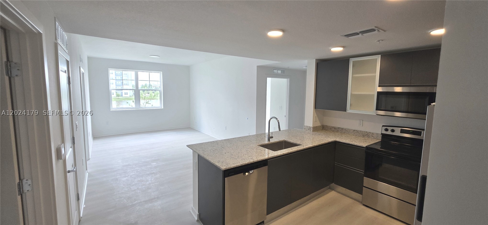 Welcome to luxury lakefront living in Orlando's highly desirable Millenia district. Located in the newly developed Millenia Park, this spacious 2-bd, 2-bath + den residence offers one of the community's largest floorplans with 1,085 SqFt of thoughtfully designed living space and beautiful lake views.

Designed for today's lifestyle, the open-concept layout features 9-foot ceilings, abundant natural light, contemporary finishes, and a split-bedroom design for enhanced comfort and privacy. The modern kitchen showcases European-style cabinetry, granite counters, stainless steel appliances, and a breakfast bar perfect for everyday living or entertaining. The versatile den offers the flexibility of a home office, guest room, media room, or additional living space—providing the functionality of a 3-bedroom home without the higher price point.

Enjoy peaceful water views from every window, ideal for morning coffee or evening relaxation. Residents enjoy resort-style amenities including a luxury pool, clubhouse, fitness center, tennis courts, lakeside walking trails, playground, dog park, and enhanced security.

Ideally located minutes from The Mall at Millenia, Orlando Premium Outlets, Universal Studios, International Drive, and Epic Universe, with convenient access to I-4, Florida's Turnpike, SR-528, and Downtown Orlando.

A rare opportunity to own a lakefront residence in one of Orlando's fastest-growing areas, offered below current developer pricing.