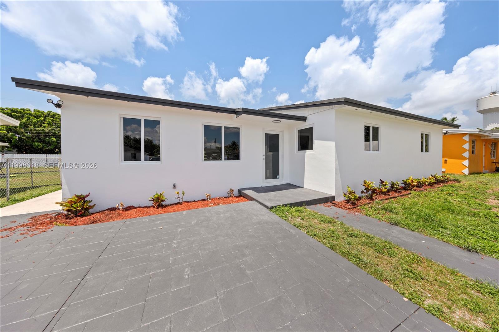 Brand new roof and impact windows and doors, tile floors through out and updated kitchen and bathrooms. Must see home with a huge lot and and concrete stamped drive way with room for the whole family. Prefered lender can also contribute $5k. NO FLOOD Insurance! Rear access for large boats, Rvs and trailers. Willing to work with county programs! No HOA