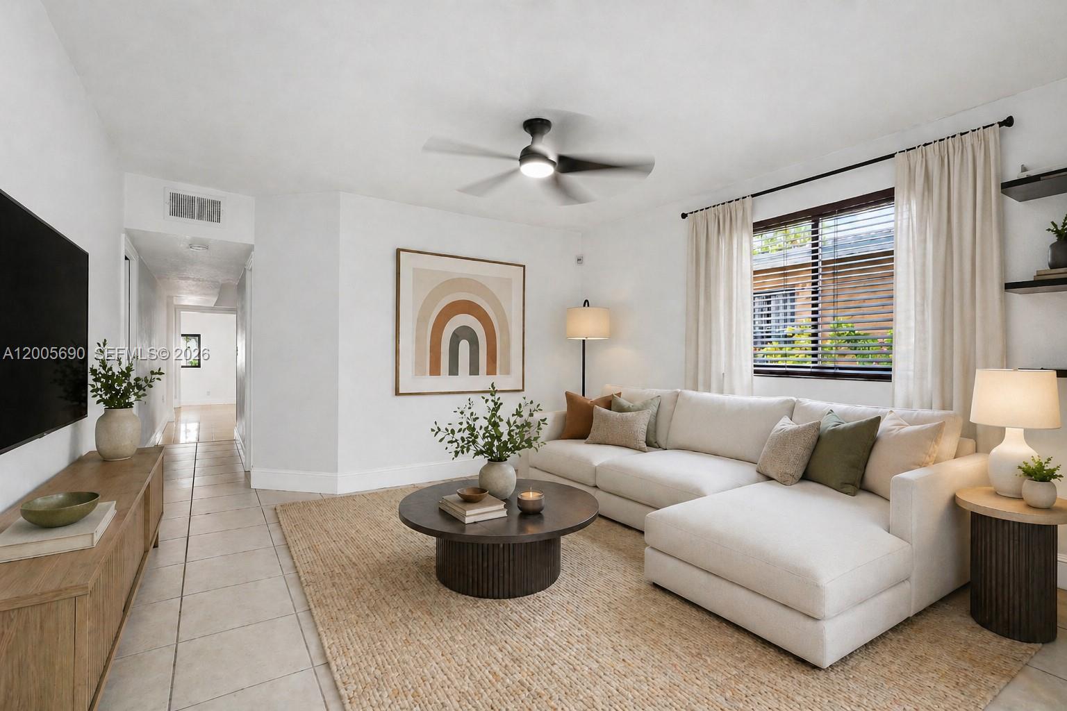 On a sunlit corner at the edge of The Roads and West Brickell, this meticulously maintained residence offers something increasingly rare in Miami: genuine character, meaningful upgrades, and the privacy of true single-family living.

Set behind lush landscaping and anchored by a fruiting mango tree, the home pairs classic romance with modern confidence — solar panels, impact windows and doors, and a layout that honors the warmth that makes older homes enduring.

Inside, 1,716 square feet unfold across 3 bedrooms and 2.5 bathrooms, filled with natural light from multiple exposures. A private wing — its own bedroom, full bath, and two linen closets behind a pocket door — delivers rare versatility: guest retreat, in-law suite, home office, or multigenerational living.
What makes this property compelling is also what it avoids: no HOA, no shared walls, no board approvals. Just house and land, fully your own.

The location seals it. At the edge of one of Miami's most established residential neighborhoods, you're steps from Café La Trova, Calle Ocho, Brickell City Centre, Mary Brickell Village, Downtown, and MIA — culture, commerce, and connectivity without sacrificing residential calm.

This is not condo living reimagined. It is something more enduring. A corner-lot residence with historic character, modern infrastructure, and the freedom only a true single-family home can offer.