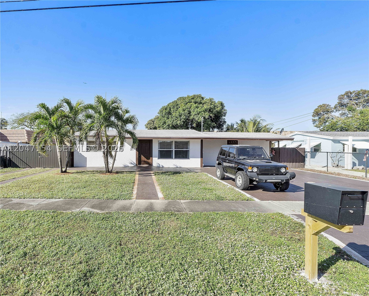 Spacious Lot on a quiet private street in the sought-after Plantation City. This beautiful home offers 3 beds and 2 full remodelled bathrooms. Convenient split floor plan. As you step into the spacious living room, you will appreciate the open-concept design and modern kitchen, making it easy to start your day.  Tile floors throughout make maintenance effortless.  Huge custom-made walk-in closets in the primary bedroom. Separate tub and shower in the master bathroom. Private fenced backyard with your mature productive mango tree.  NO HOA here. Bring your boat, RV, or multiple cars with double parking spaces and enough additional space to the side of the house to park more vehicles behind a tall fence. Great location, near lush parks, schools, shops, Fort Lauderdale International Airport, downtown, ocean, and highways.