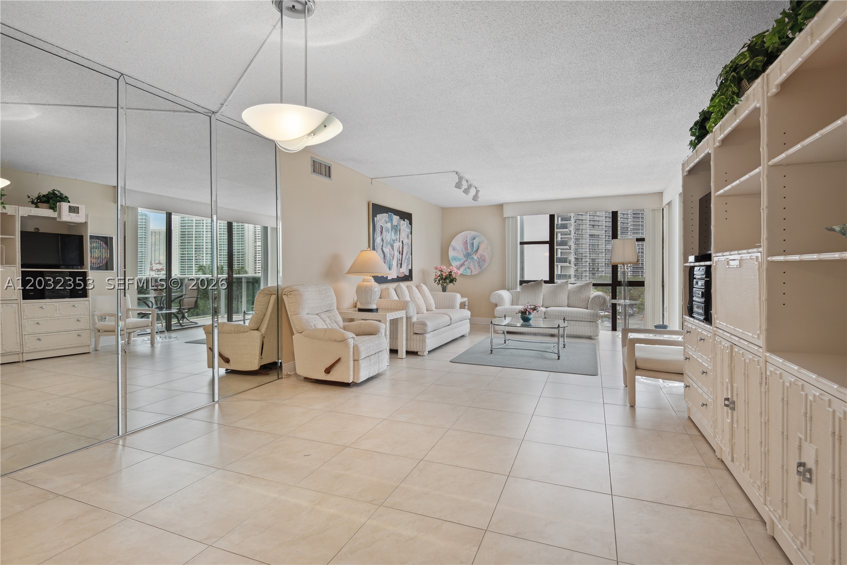 Experience the epitome of luxury living in this expansive corner unit, one of the largest floor plans available within the prestigious development. Ideally situated on the renowned Country Club Drive, this residence offers an unparalleled lifestyle. Enjoy breathtaking, panoramic views overlooking the lush greenery of the Turnberry PGA golf course and the world-class resort. The property includes the added convenience of dedicated covered parking, ensuring comfort and ease. This is a rare opportunity to own a premier condo in a highly sought-after location.