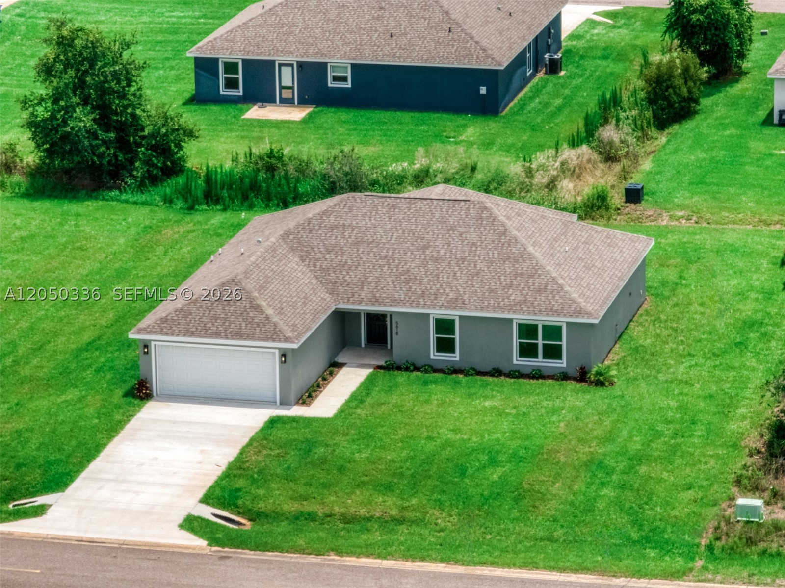 Welcome to this beautifully designed "Lakewood Model", located Sun N Lake Golf Community. This brand-new home features a light and bright open floor plan with over 1,700 square feet of living space.  The thoughtfully designed layout includes 4 bedrooms, 2 full bathrooms, and an attached 2 car garage, providing plenty of room for family, guests, or a home office. Interior upgrades include waterproof luxury vinyl plank flooring throughout the home, quartz countertops, modern LED lighting, and a brand new stainless steel appliance kitchen package. The open-concept living and dining areas create a welcoming space ideal for both everyday living and entertaining. Peace of mind with central sewer and water irrigation system with 3 zone Hunter automatic timer  and underground utilities. Not all new construction offer water irrigation systems like this home. Located in the vibrant Sun N Lake Country Club community, residents enjoy an active lifestyle with two championship 18-hole golf courses, a community pool (a newly expanded pool coming soon), playgrounds, pickleball courts, basketball courts,  dog park, and numerous other recreational hiking trails. Conveniently located near medical facilities, shopping, dining, and all that Sebring has to offer, this home is an excellent opportunity to enjoy Florida living in one of the area's most sought after communities. *Some photos have been enhanced with virtual staging. Closing credit incentive using preferred lender New American Funding.