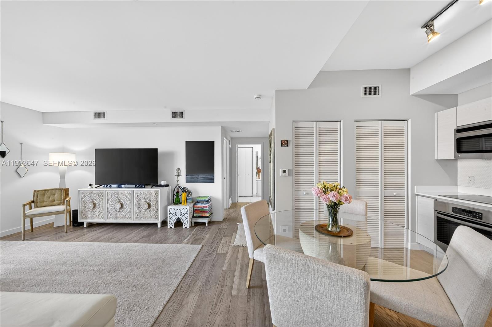 Experience elevated city living at Baltus House, a boutique-style condominium ideally situated in the heart of Miami's Design District. This beautifully appointed 1-bedroom plus den residence features a thoughtfully designed floor plan, engineered wood flooring throughout, and contemporary finishes that create a warm, sophisticated living environment.

Step outside and immerse yourself in one of Miami's most dynamic neighborhoods, home to world-renowned luxury boutiques, acclaimed restaurants, art galleries, and cultural destinations. Whether enjoying a morning coffee, an afternoon of shopping, or an evening out, everything is just moments from your door.

Baltus House offers an exceptional collection of amenities, including a stunning rooftop deck with panoramic skyline views, a resort-style 7th-floor pool deck with two pools and a hot tub, a state-of-the-art fitness center, club room, and more.

Perfectly positioned just 15 minutes from Miami International Airport, Wynwood, Miami Beach, and Downtown Miami, this residence offers both convenience and lifestyle. An added luxury is the assigned parking space located on the same level as the unit, making everyday living effortless.

Discover the perfect blend of style, location, and convenience in one of Miami's most sought-after neighborhoods.