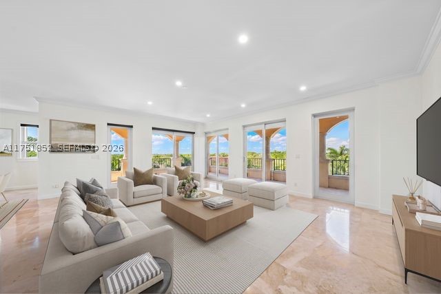 Welcome to Deering Bay Yacht and Country Club’s life style.  This great fifth floor unit in the Padua building features 3 spacious bedrooms with their own bathroom and walk-in closet, half bath, 2 parking spaces next to each other #106-107, ample A/C storage and 1 golf cart parking space #28. The apartment's floors are marble and wood, it has a separate office and lots of storage spaces inside. This unit is surrounded by wide balconies and the best sunset view that you can ever ask for. Walk and admire the serenity of this guard-gated grounds in this community that every resident loves.
